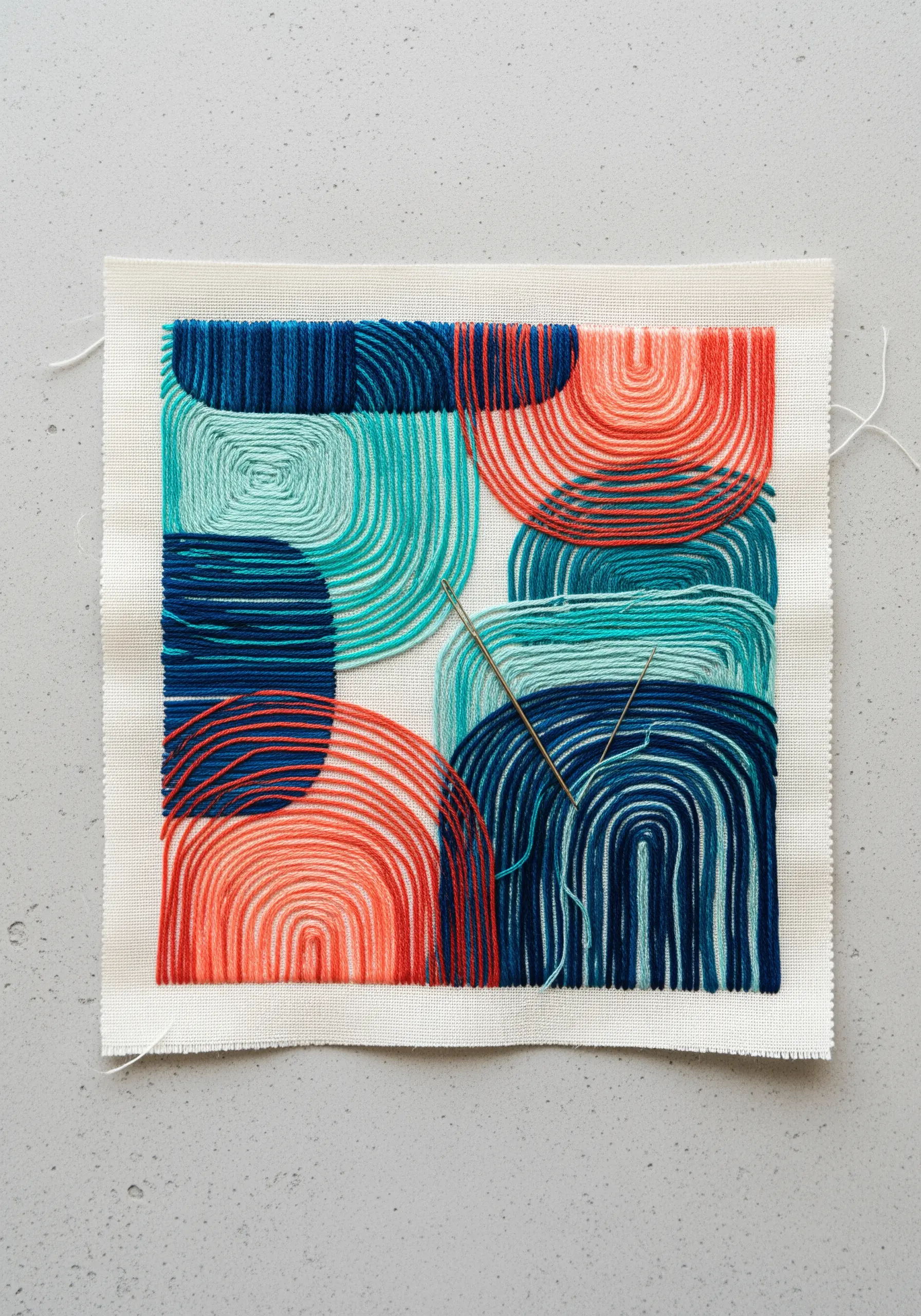Abstract composition with wrapped and couched threads in blue, teal, and coral on canvas.