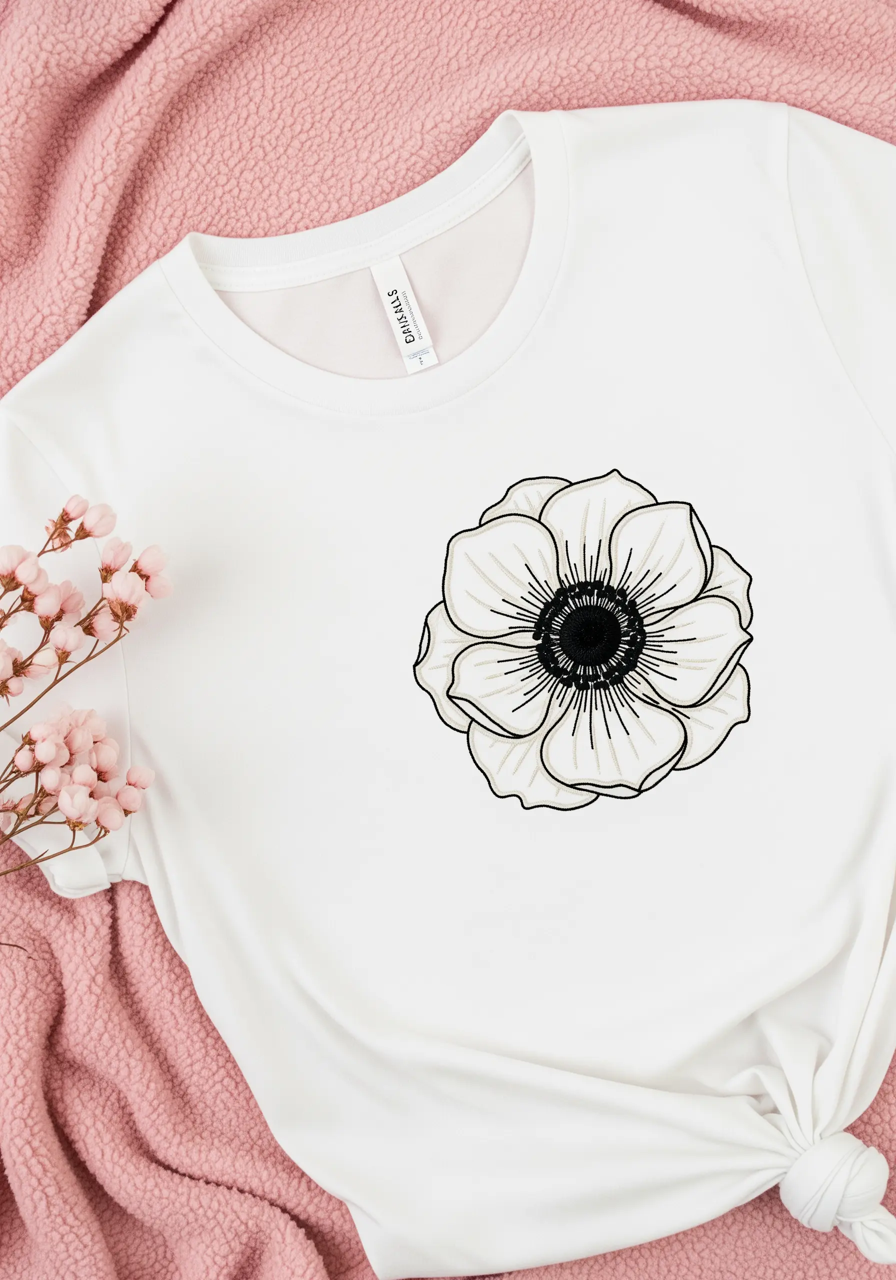 A white anemone flower with a black center, rendered in black line art.