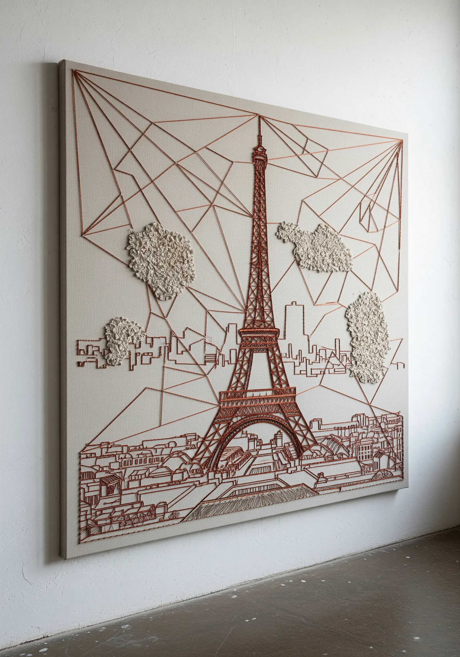Embroidered Paris skyline featuring a detailed Eiffel Tower contrasted with abstract lines and textured clouds.