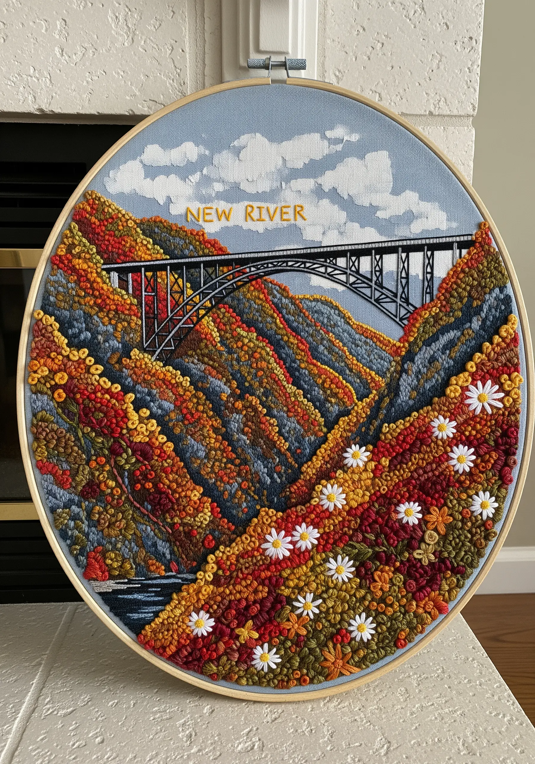 Embroidery of the New River Gorge Bridge in autumn, with hills covered in colorful colonial knots.