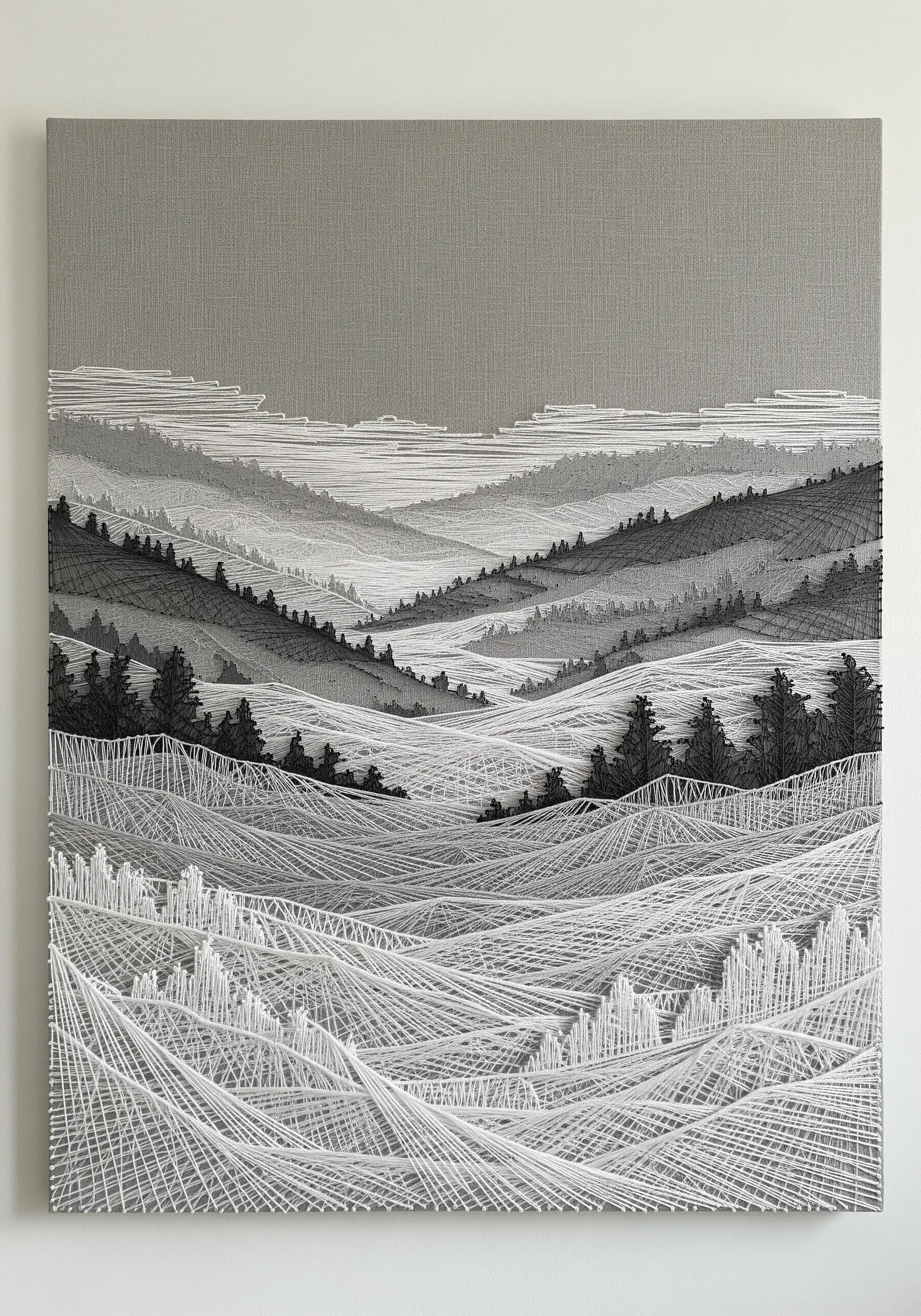 Monochromatic string art of a foggy mountain landscape with white thread creating mist.