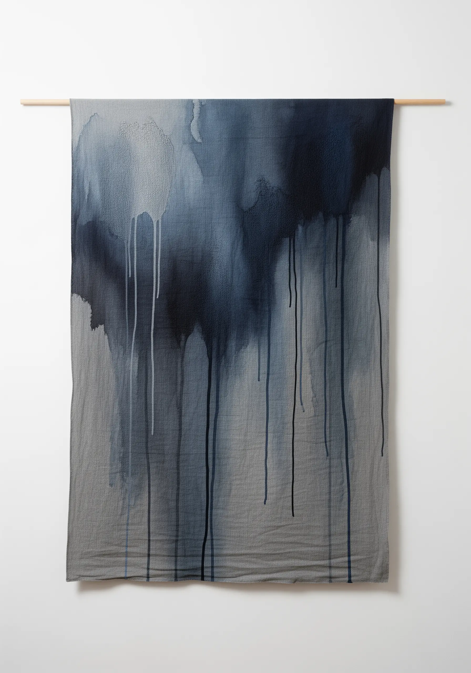A large fabric wall hanging with dark, dripping paint effects enhanced by subtle vertical stitches.