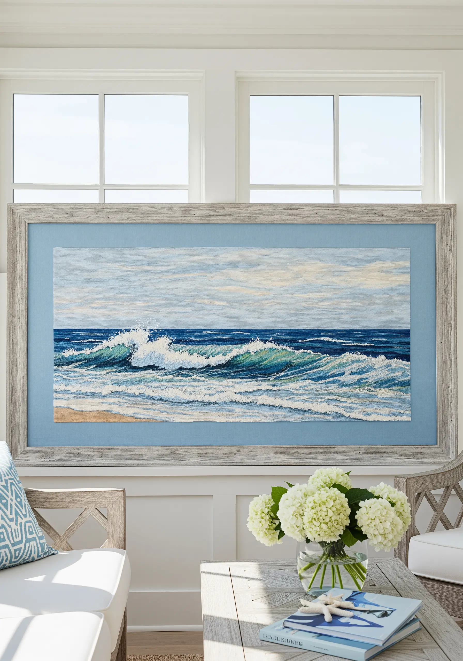 A large, detailed embroidery of an ocean wave crashing on the shore.