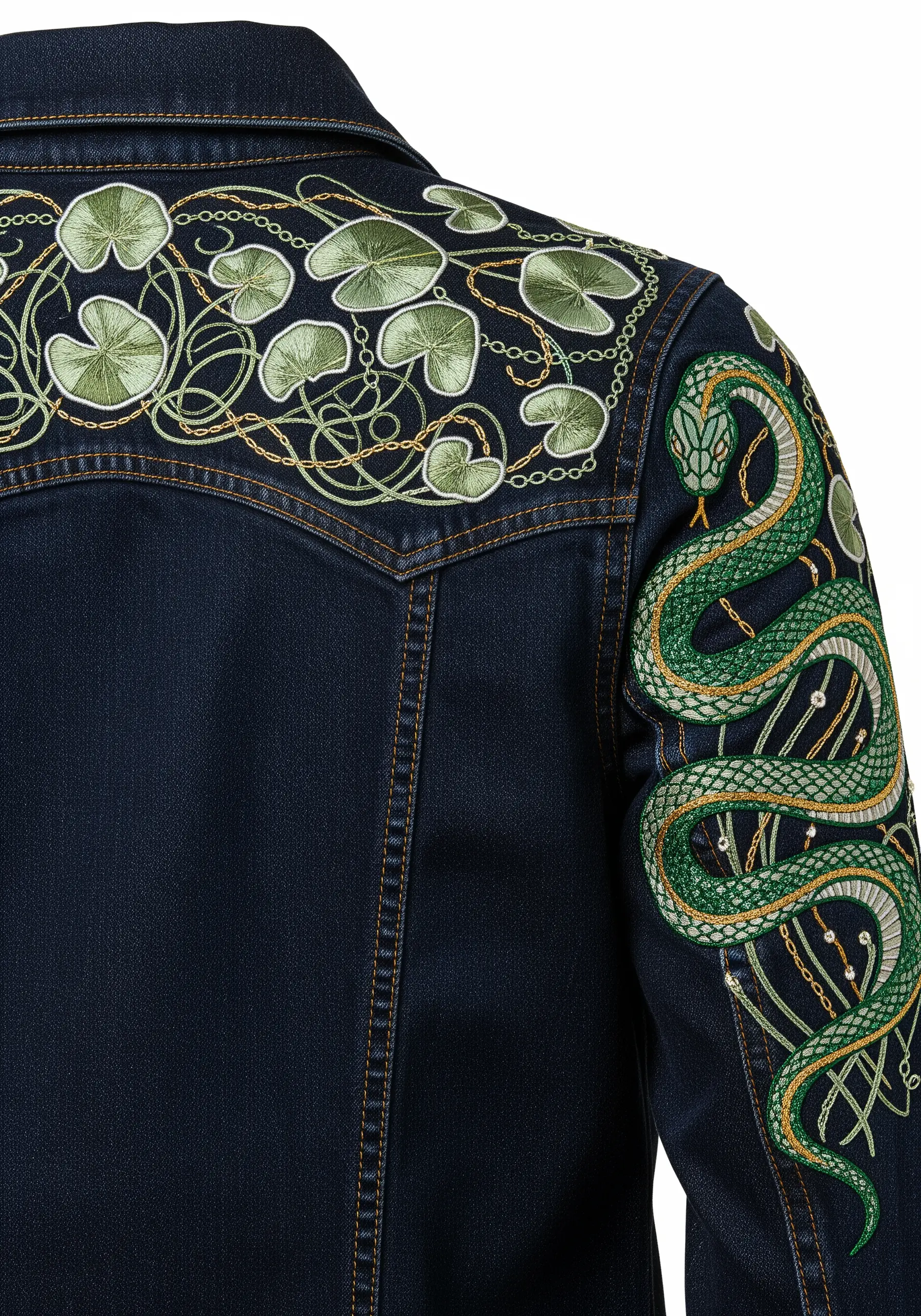 Art Nouveau-style embroidery of a green snake and water lily pads on a dark denim jacket.