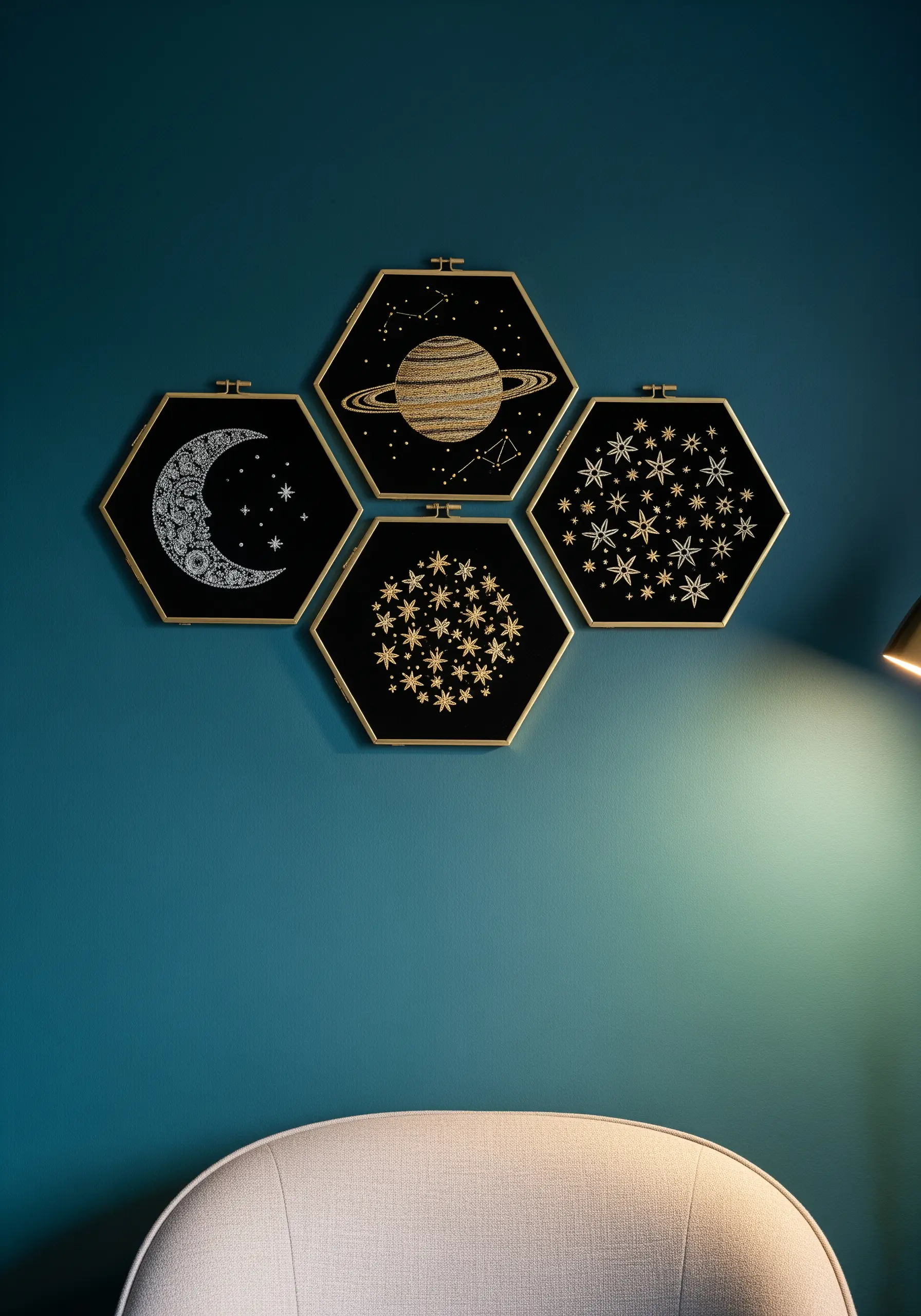 A gallery of four hexagonal frames with celestial embroidery in gold on black fabric.
