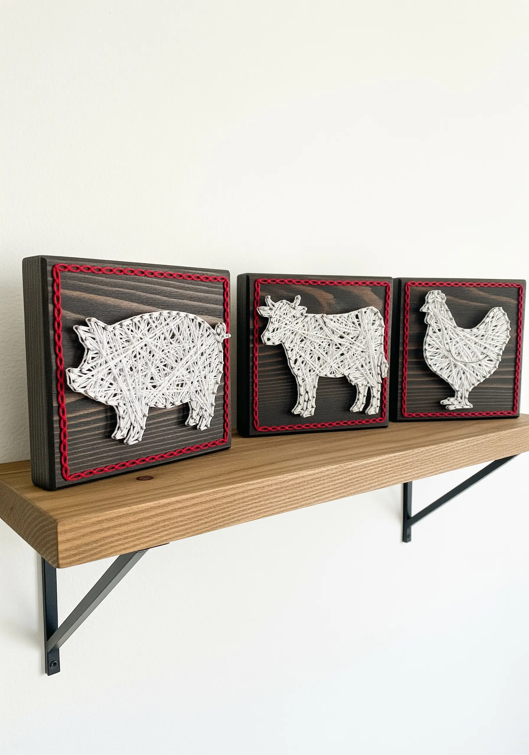 A set of three string art farm animals—pig, cow, chicken—with a thick red cord border.