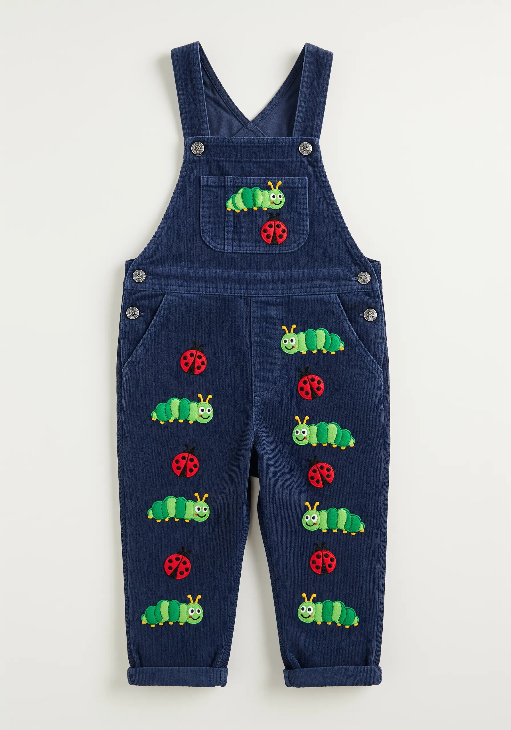 Repeating cartoon caterpillar and ladybug embroidery on the front of blue corduroy overalls