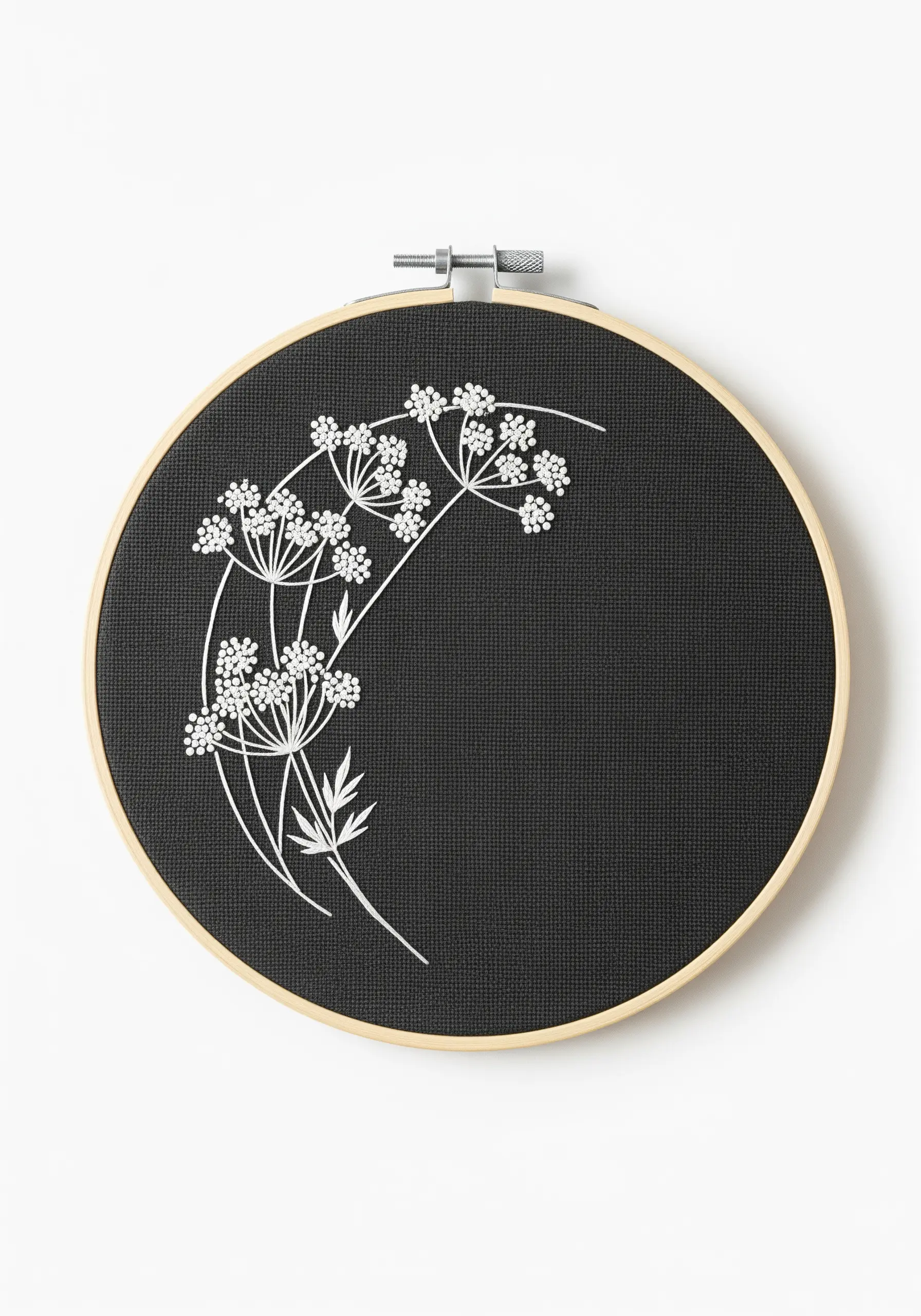 Delicate white Queen Anne's lace stitched in line art on black linen fabric.
