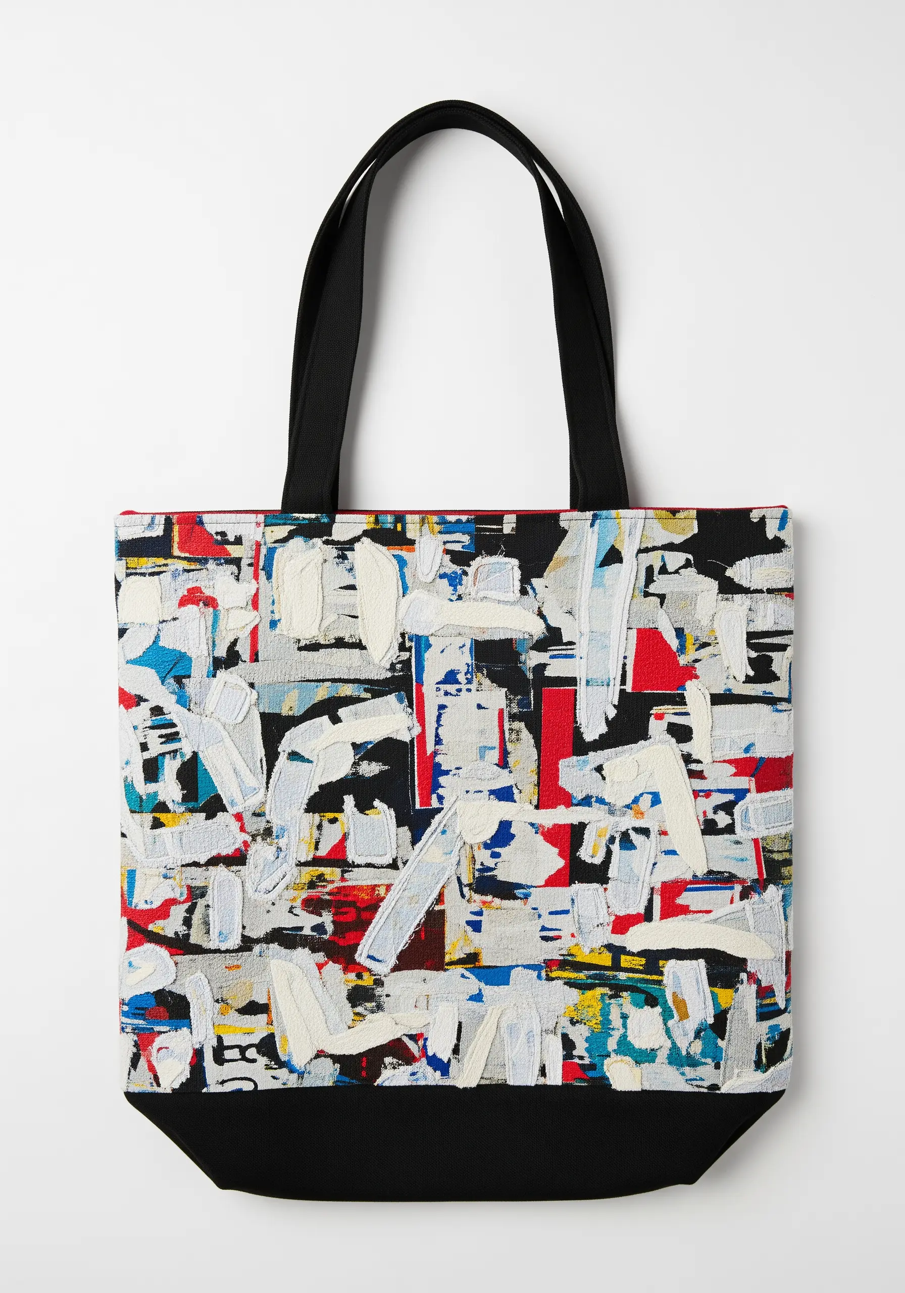 An abstract, painterly design with thick, textured embroidery on a tote bag.