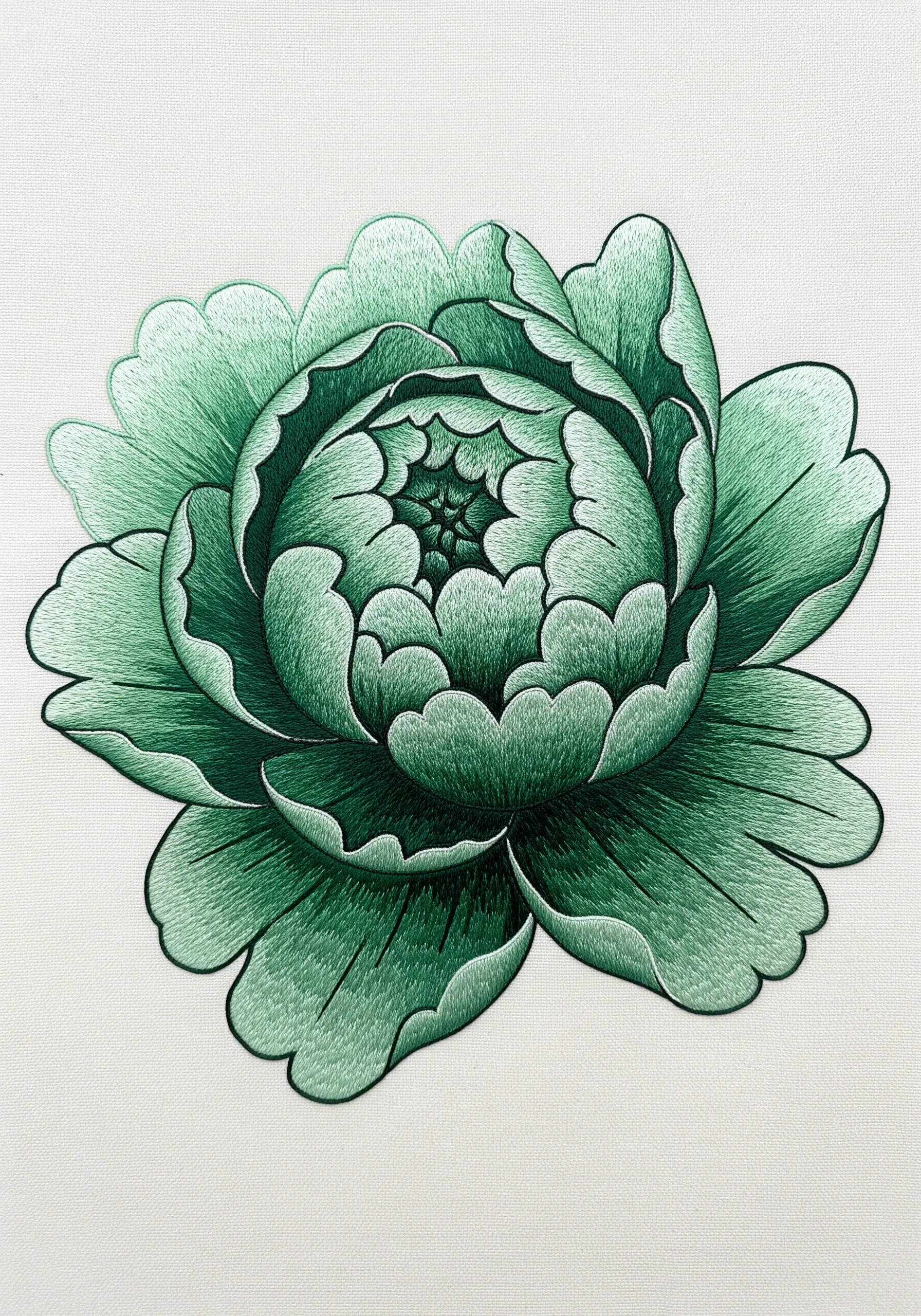 A monochrome peony embroidered entirely in shades of green, showing depth and shadow.