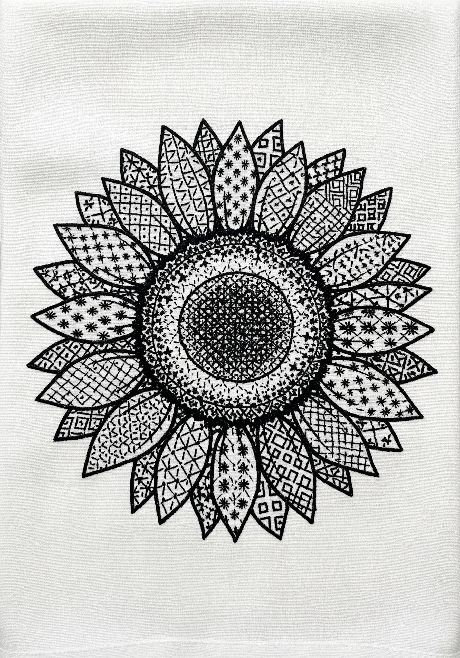 A sunflower outlined in black, with each petal filled with a different geometric blackwork pattern
