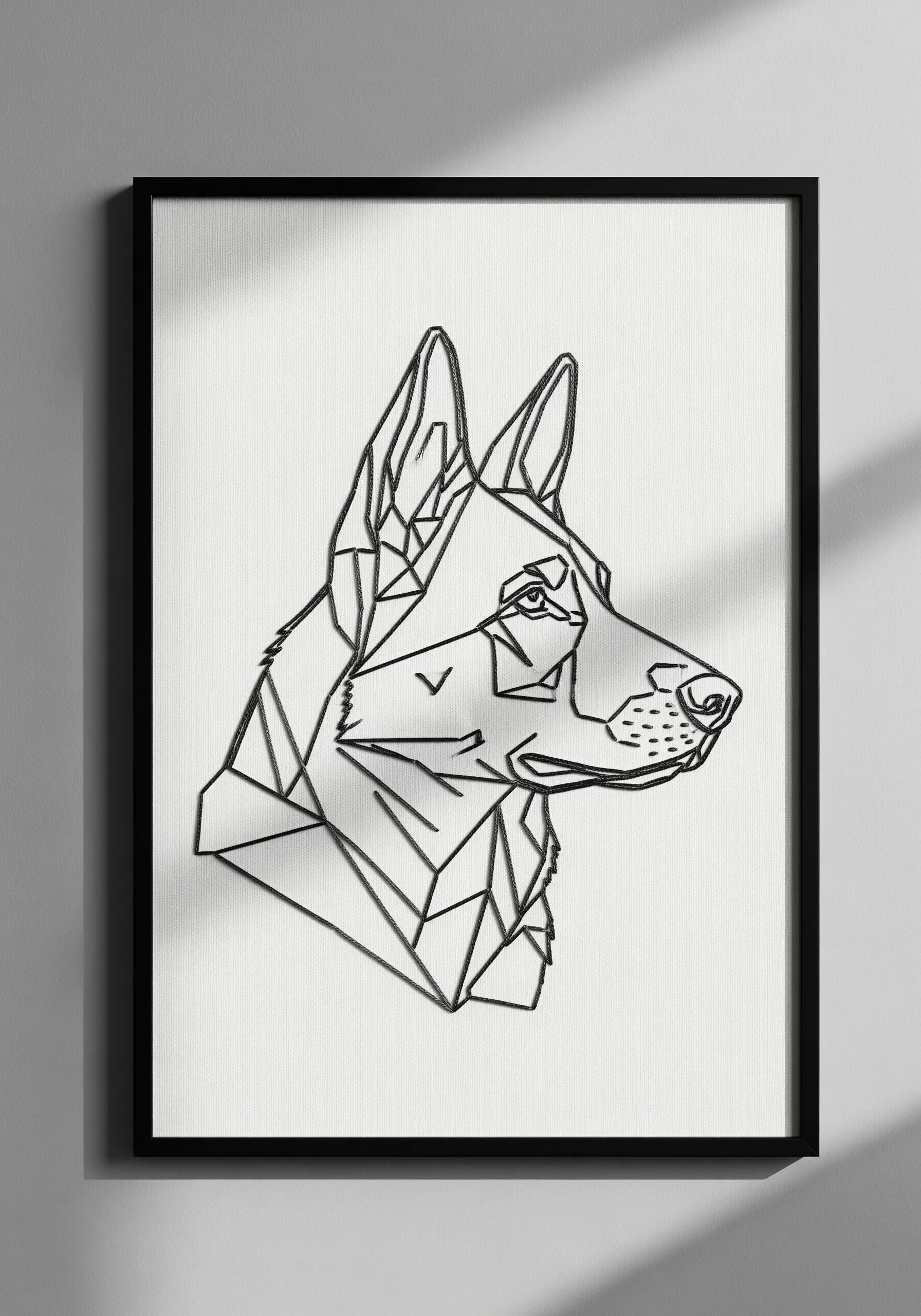Geometric line art embroidery of a German Shepherd's head in a black frame.