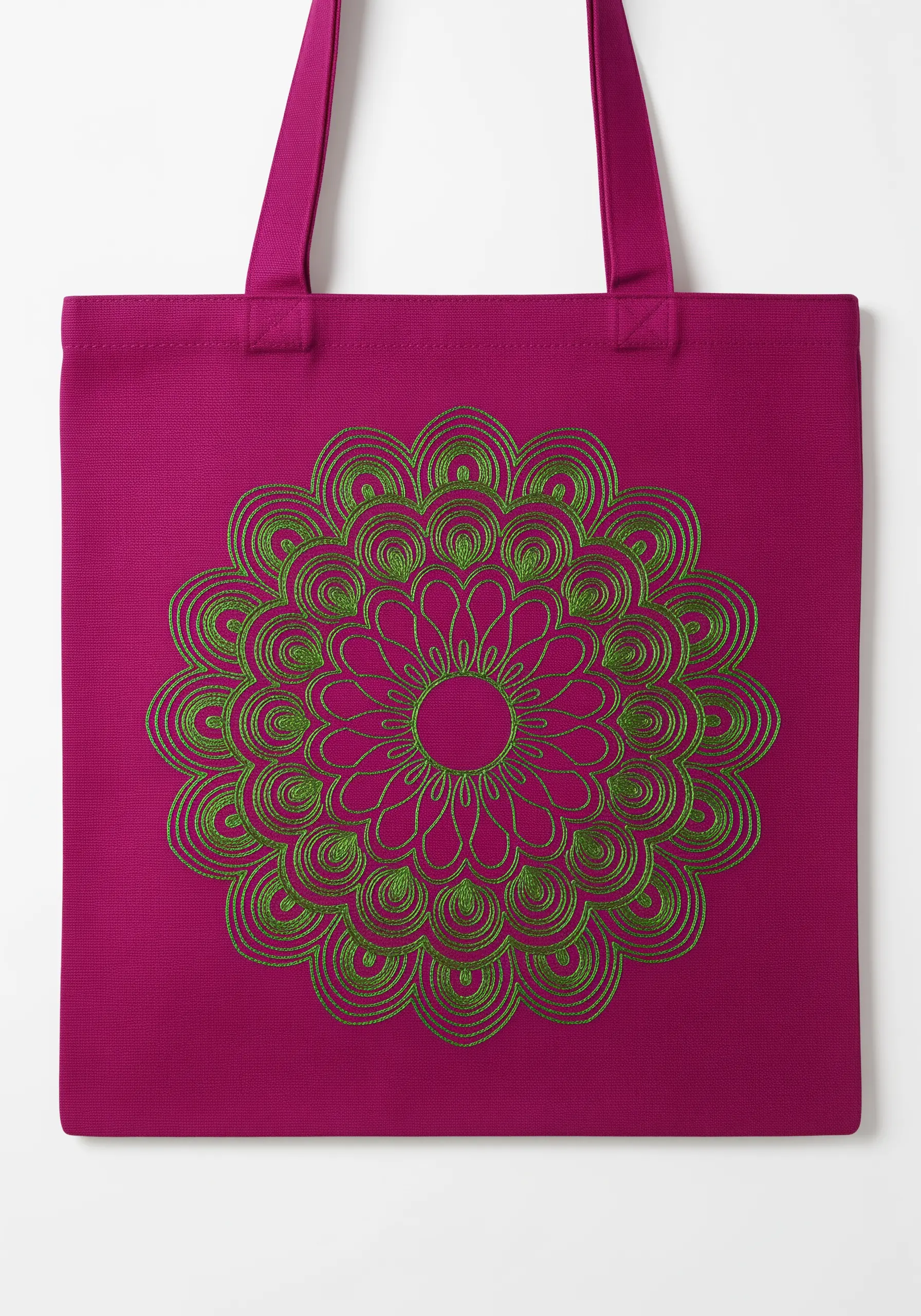 A geometric mandala of overlapping green lines, resembling a Spirograph pattern, on a magenta tote.