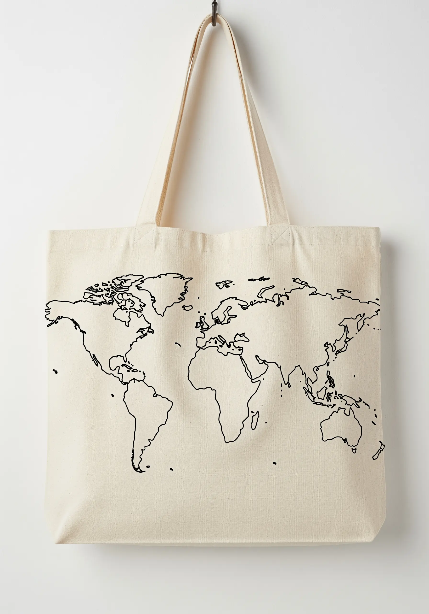 A minimalist world map embroidered in black thread on a natural canvas tote bag.