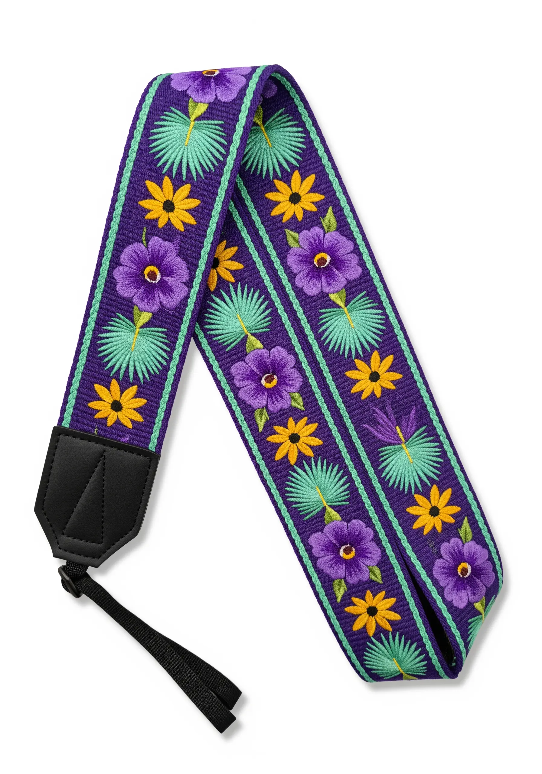 A purple camera strap with a repeating geometric pattern of embroidered flowers and palm leaves.