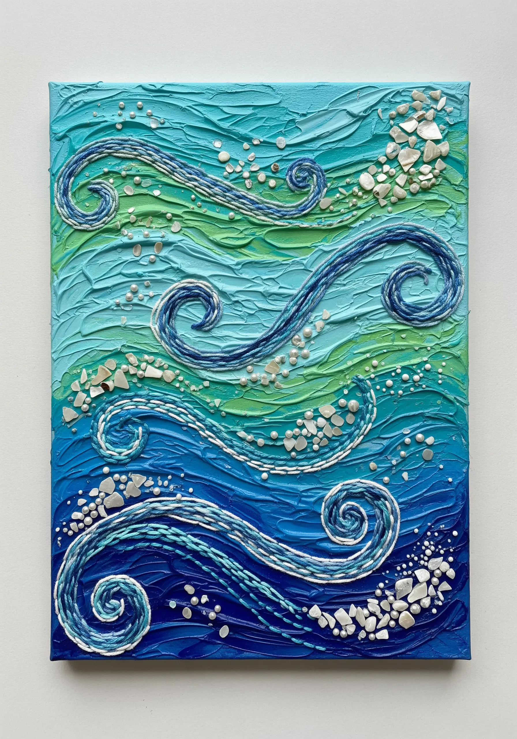 Mixed-media ocean art with thick painted texture, couched yarn swirls, and crushed shell details.