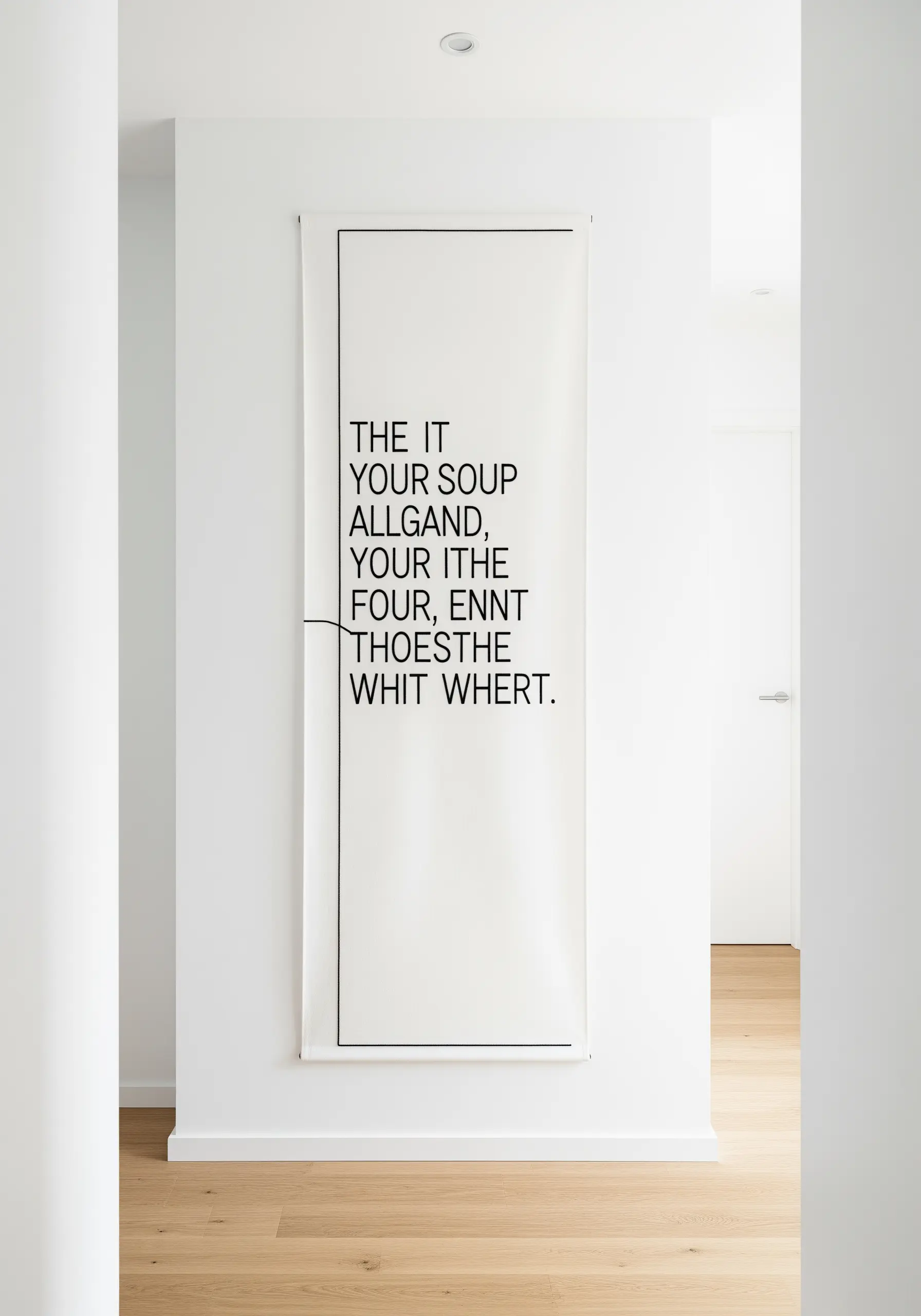 Minimalist black text embroidered on a long, narrow white wall banner.