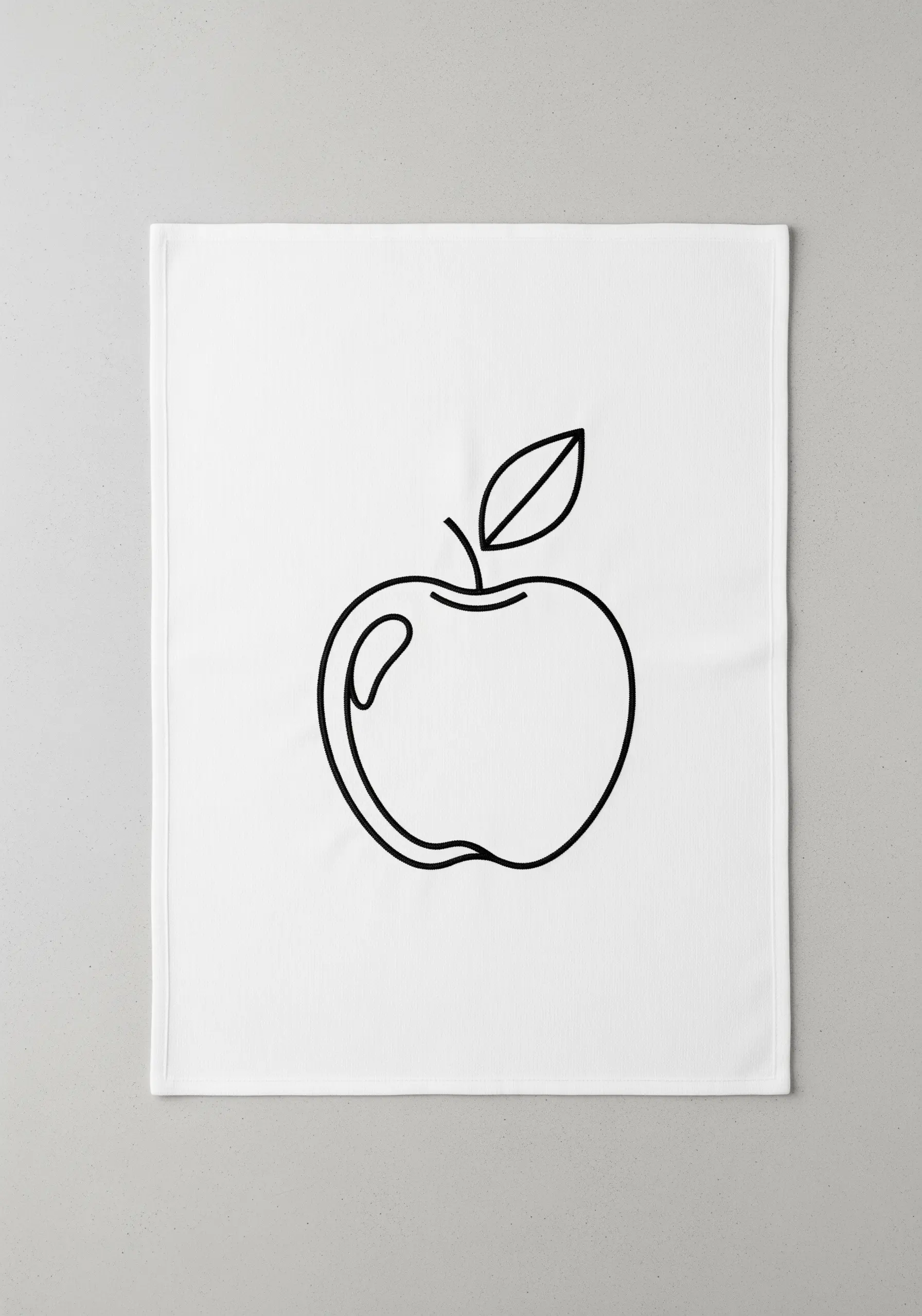 A continuous black line embroidery of an apple on a white kitchen towel.