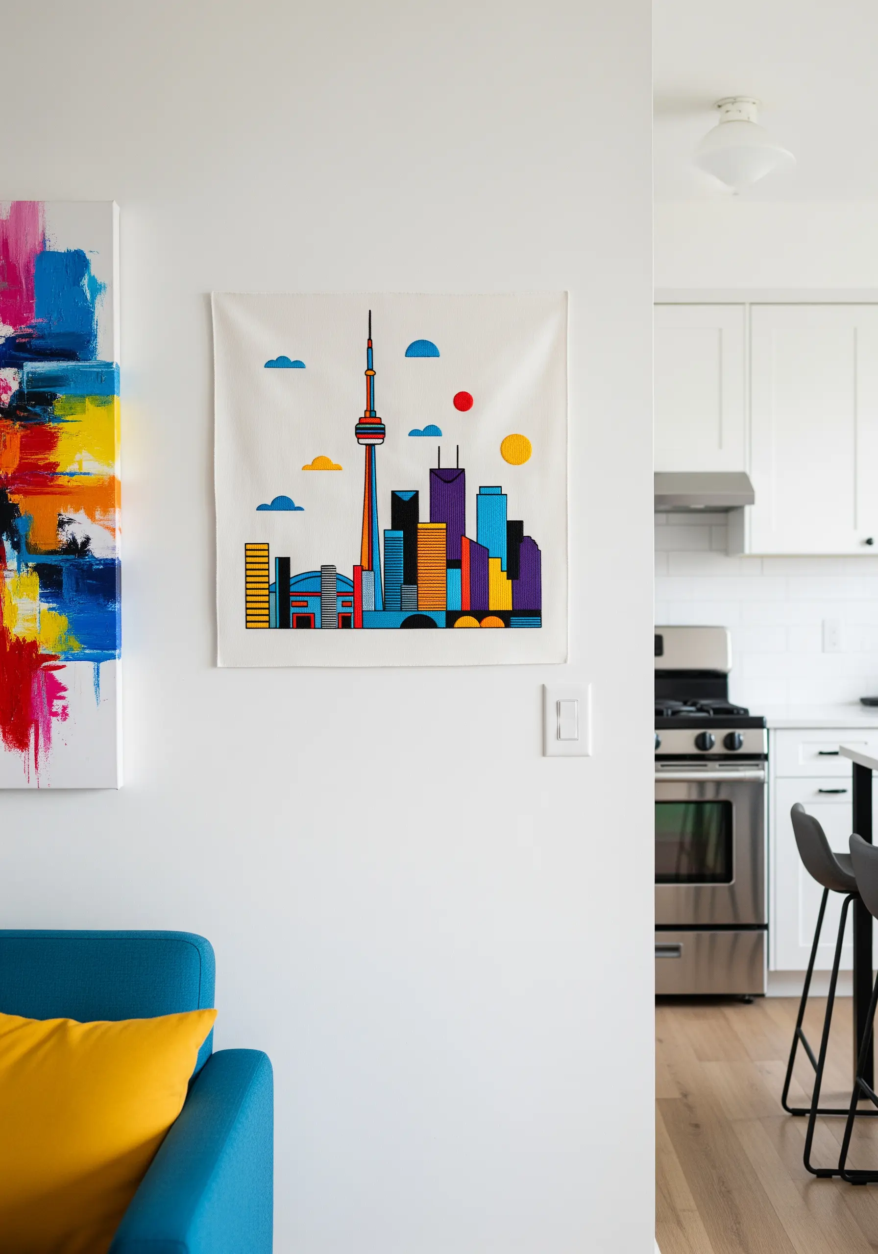 A modern, minimalist pop-art style embroidery of the Toronto skyline.