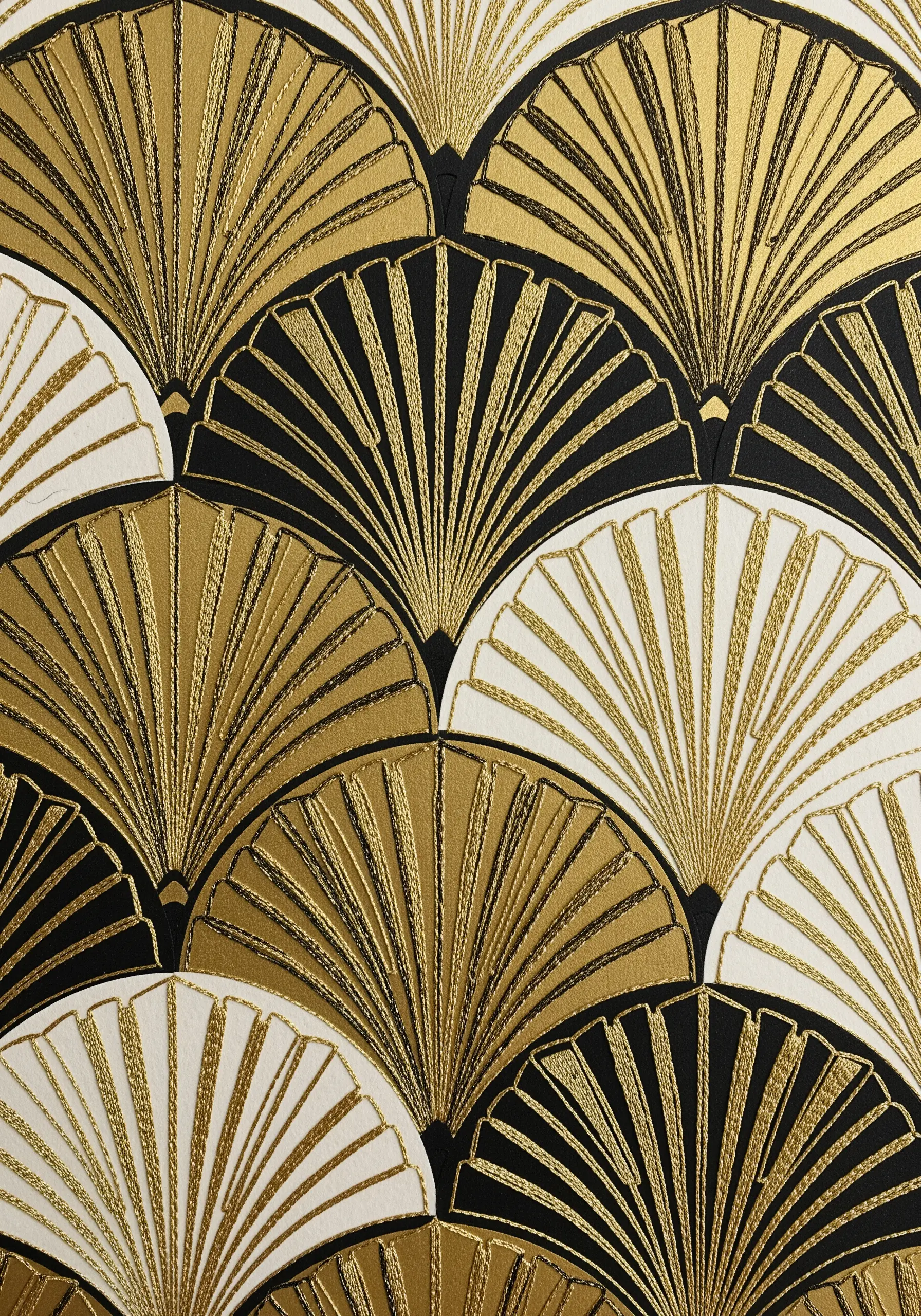 An Art Deco fan pattern in black, white, and gold, with the gold areas filled with satin stitch.
