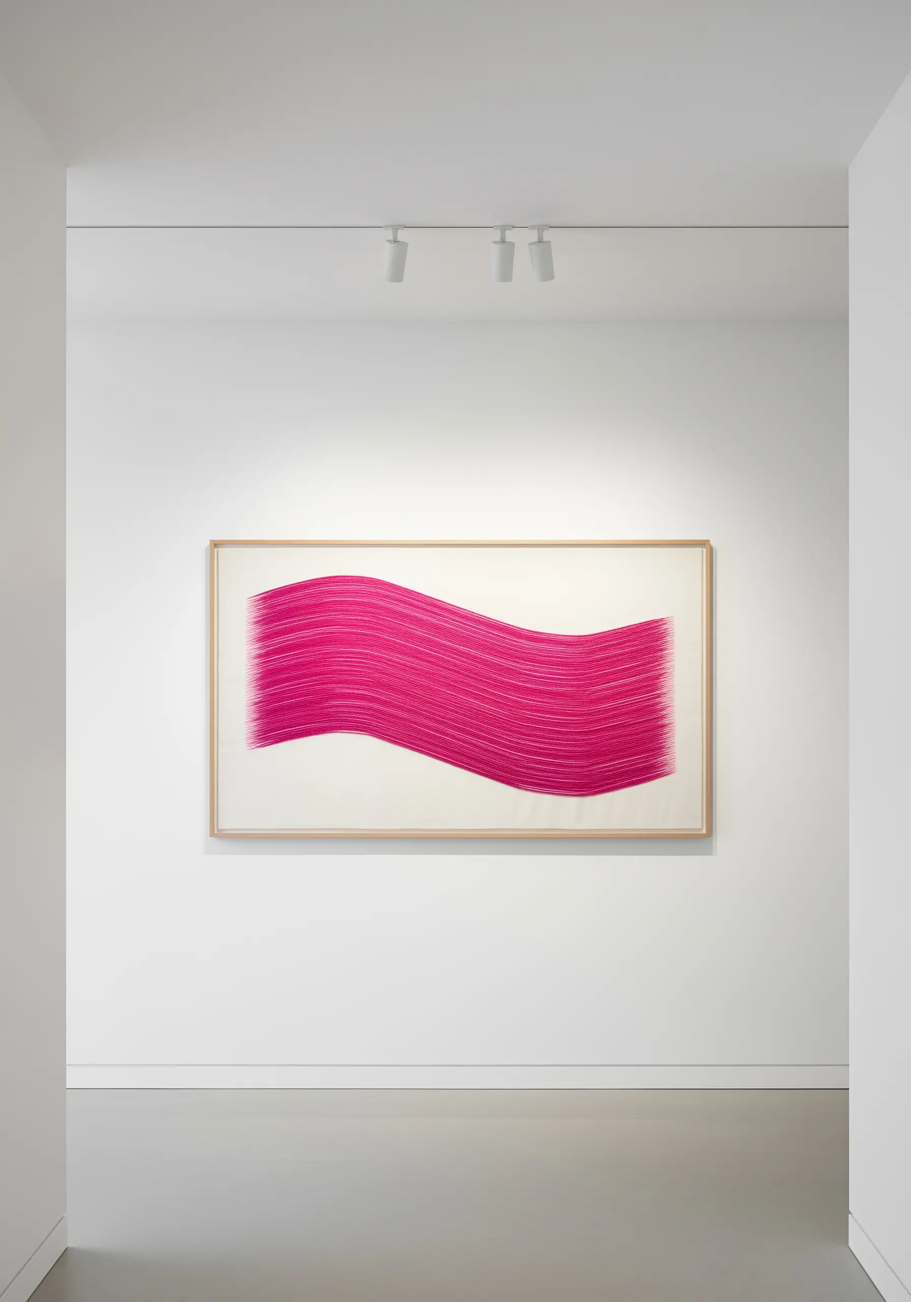 A large, minimalist artwork of a flowing pink wave made entirely of straight stitches.