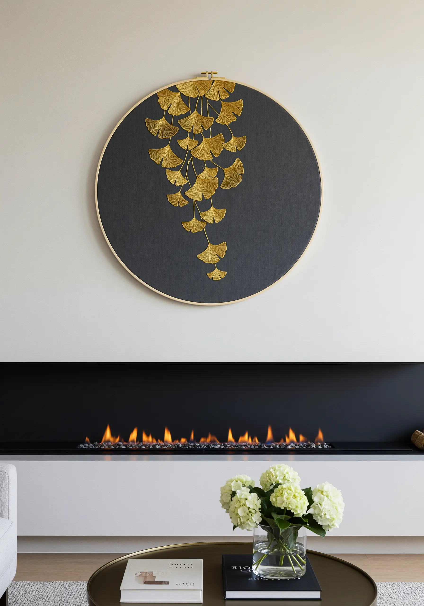 Cascading golden ginkgo leaves embroidered with metallic thread on a dark gray background.
