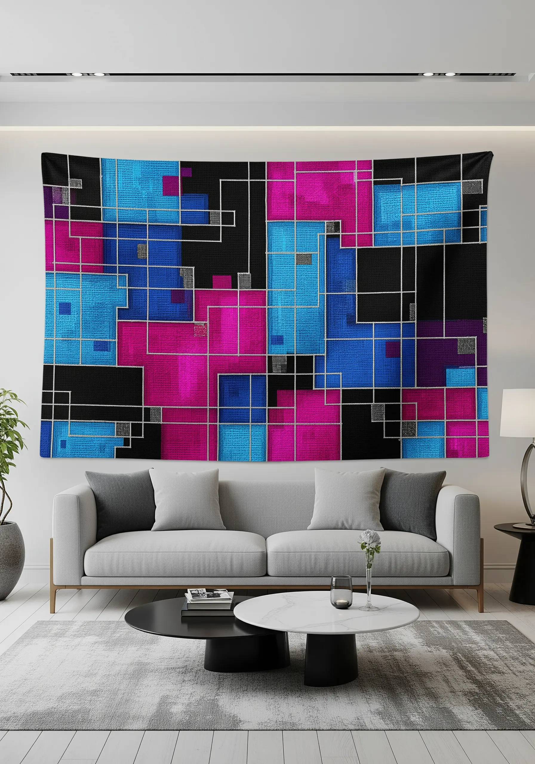 An abstract tapestry with blue, pink, and black color blocks outlined in silver metallic thread.