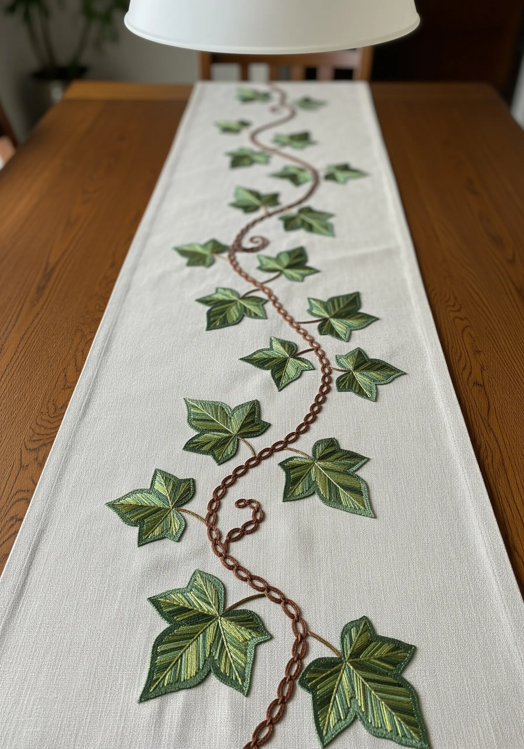Ivy vine with variegated green satin stitch leaves on a table runner