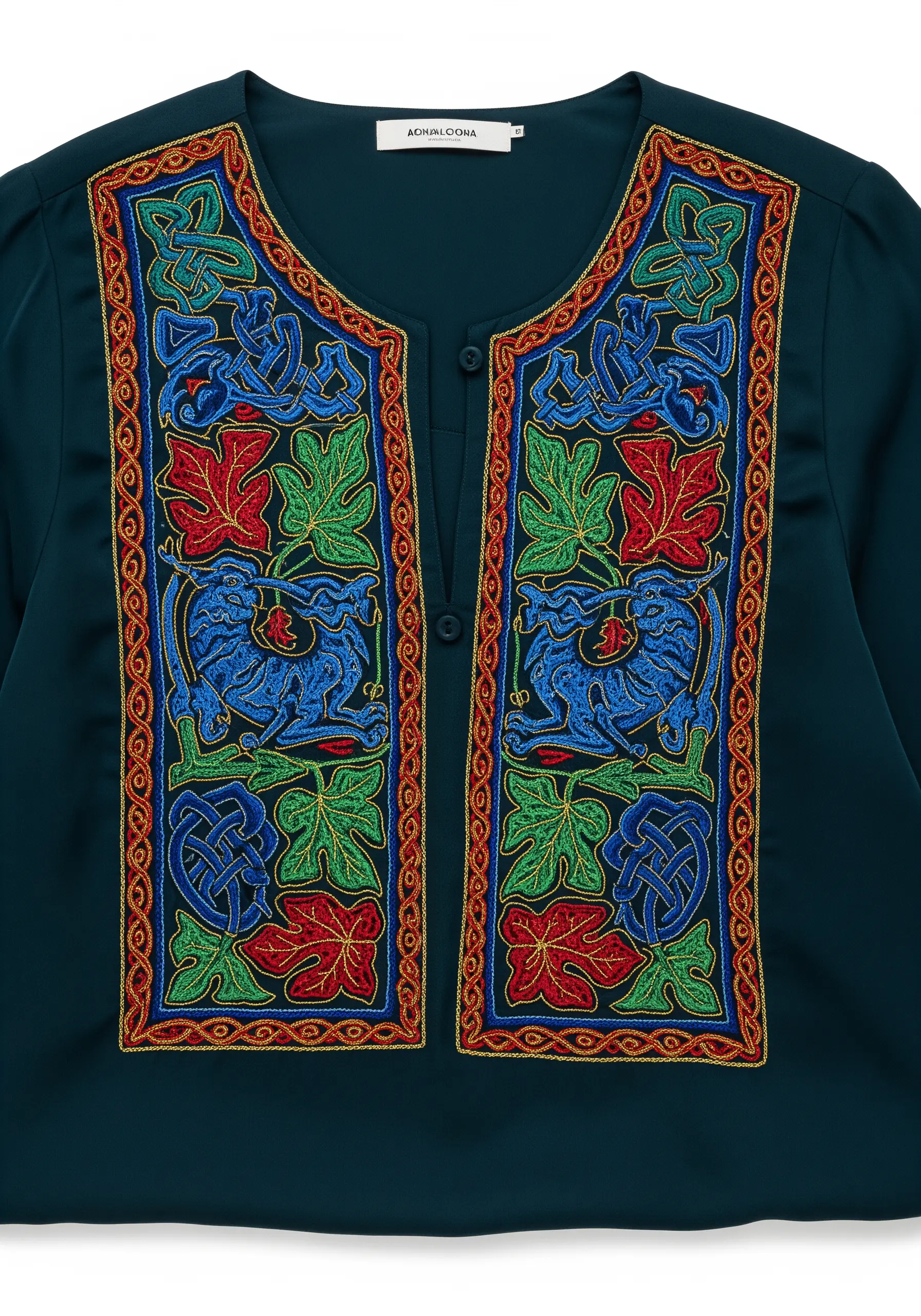 A heavily embroidered panel on a dark green blouse, featuring Celtic knots and mythical creatures.
