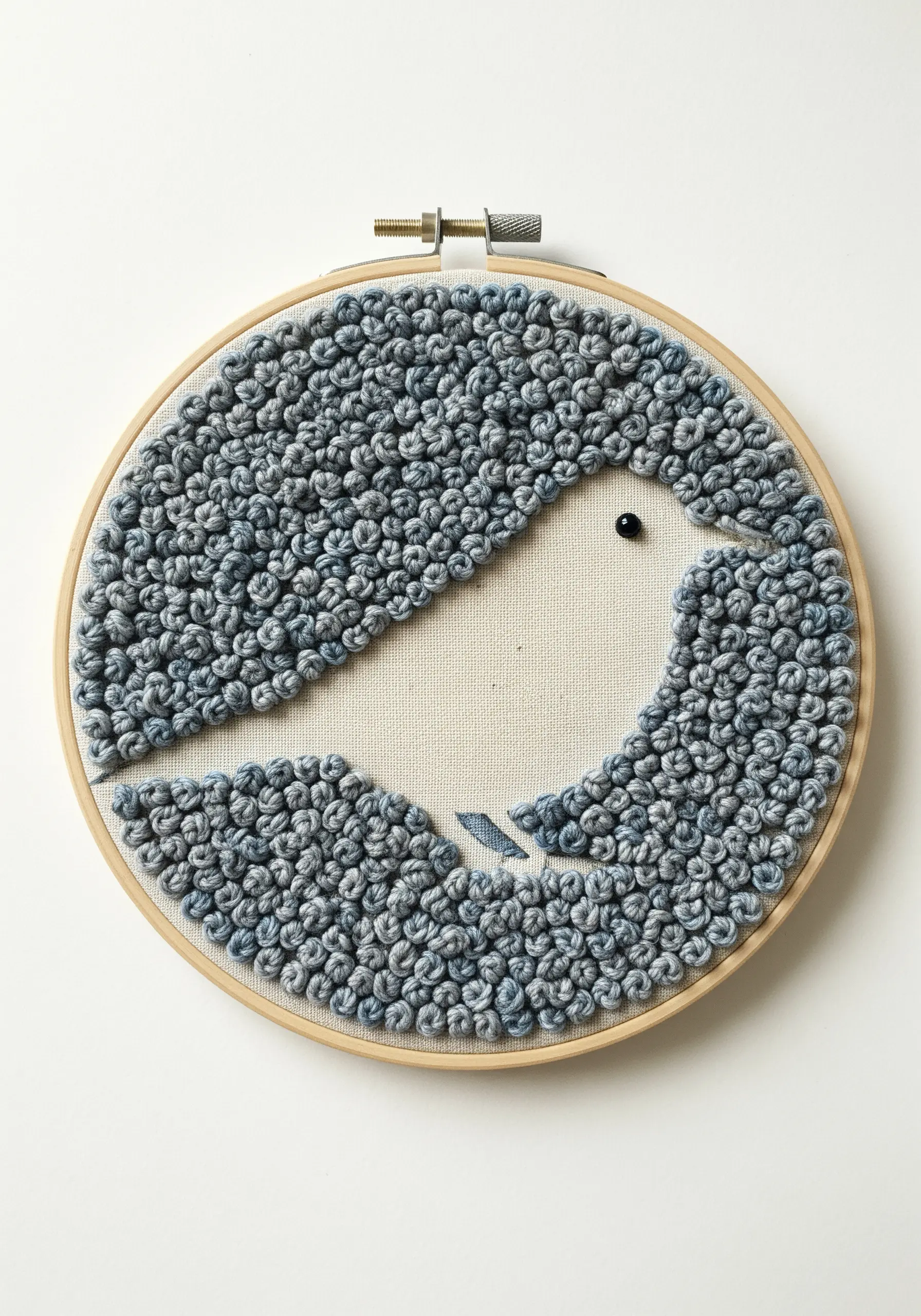 A simple bird silhouette created by filling the negative space with textured blue-gray knots.