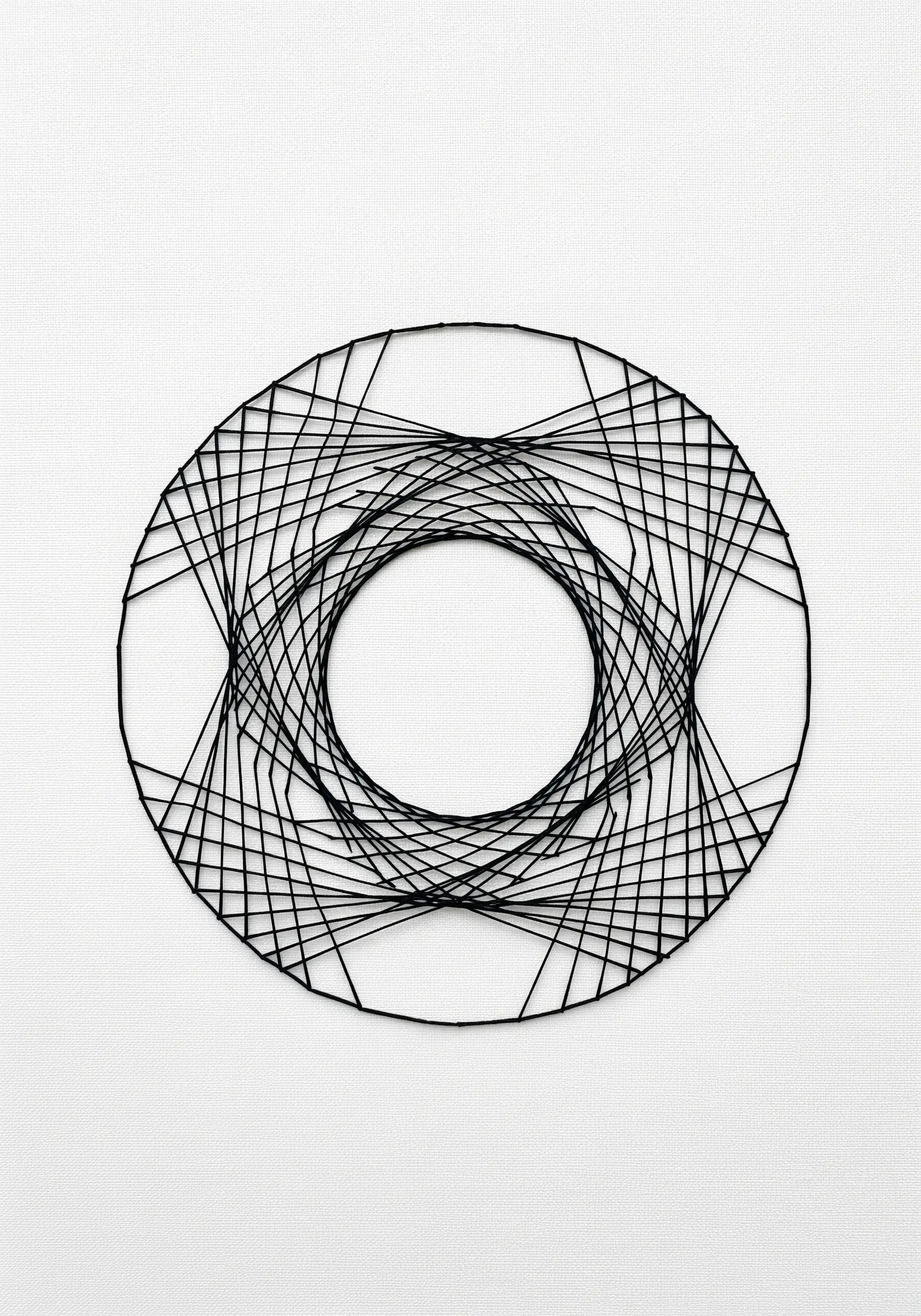 Minimalist black thread string art creating a spirograph pattern on white fabric.