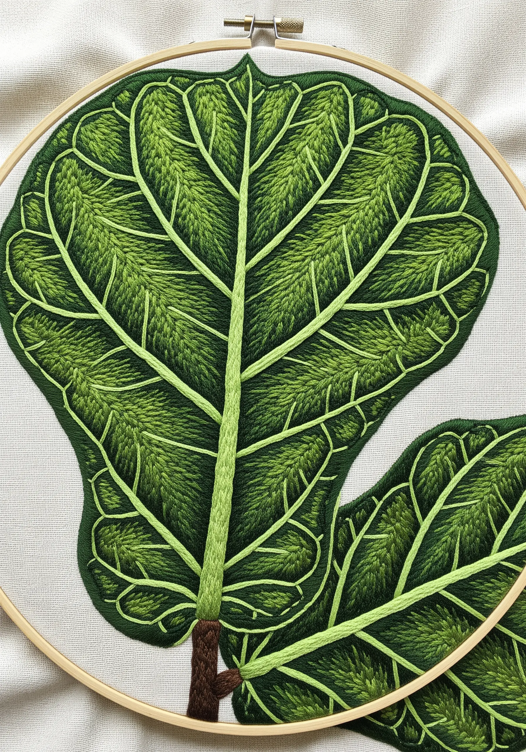 A close-up of a fiddle leaf fig with raised veins and directional green fill stitch.