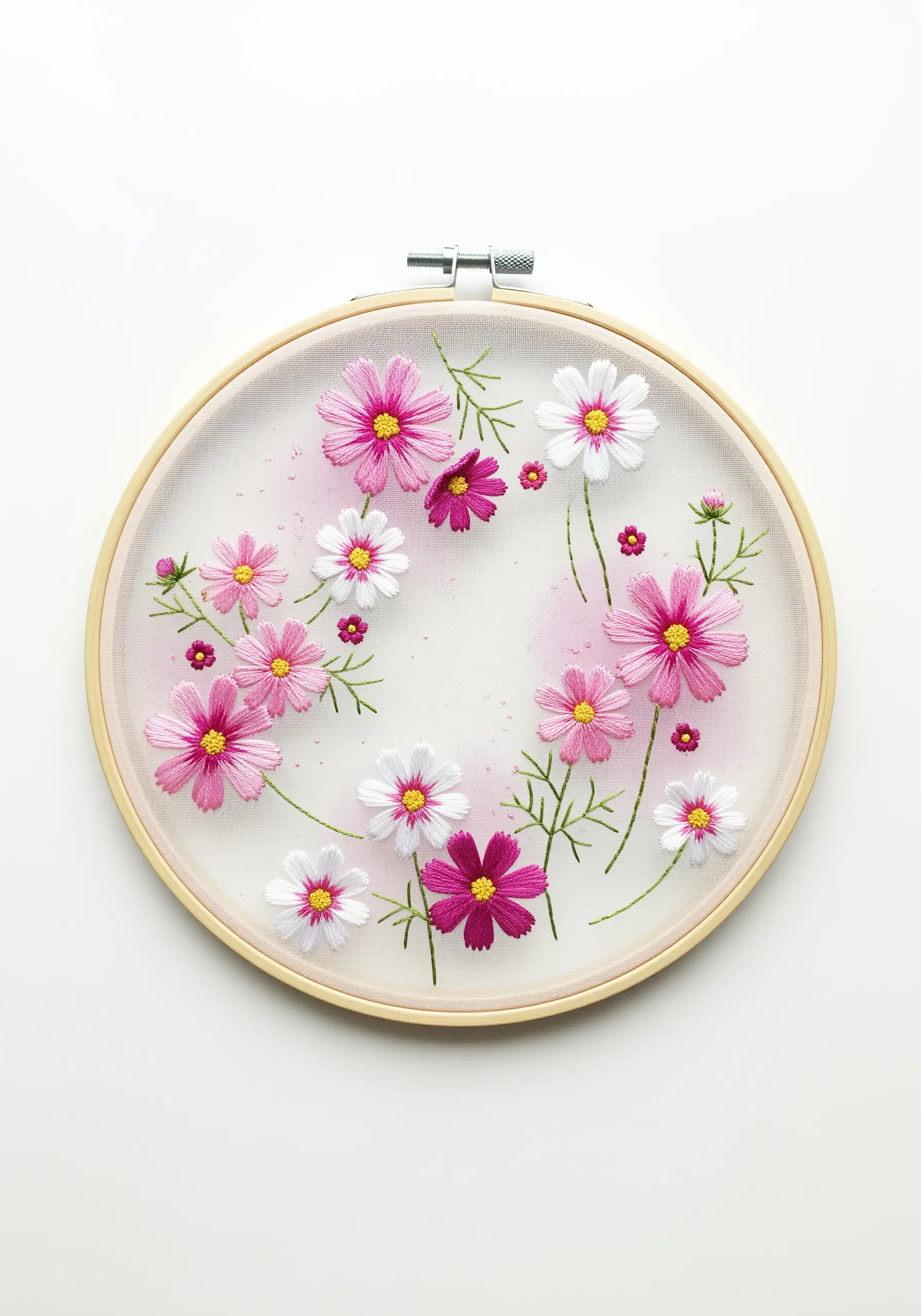 Pink and white cosmos flowers embroidered on sheer tulle with a hint of pink watercolor.
