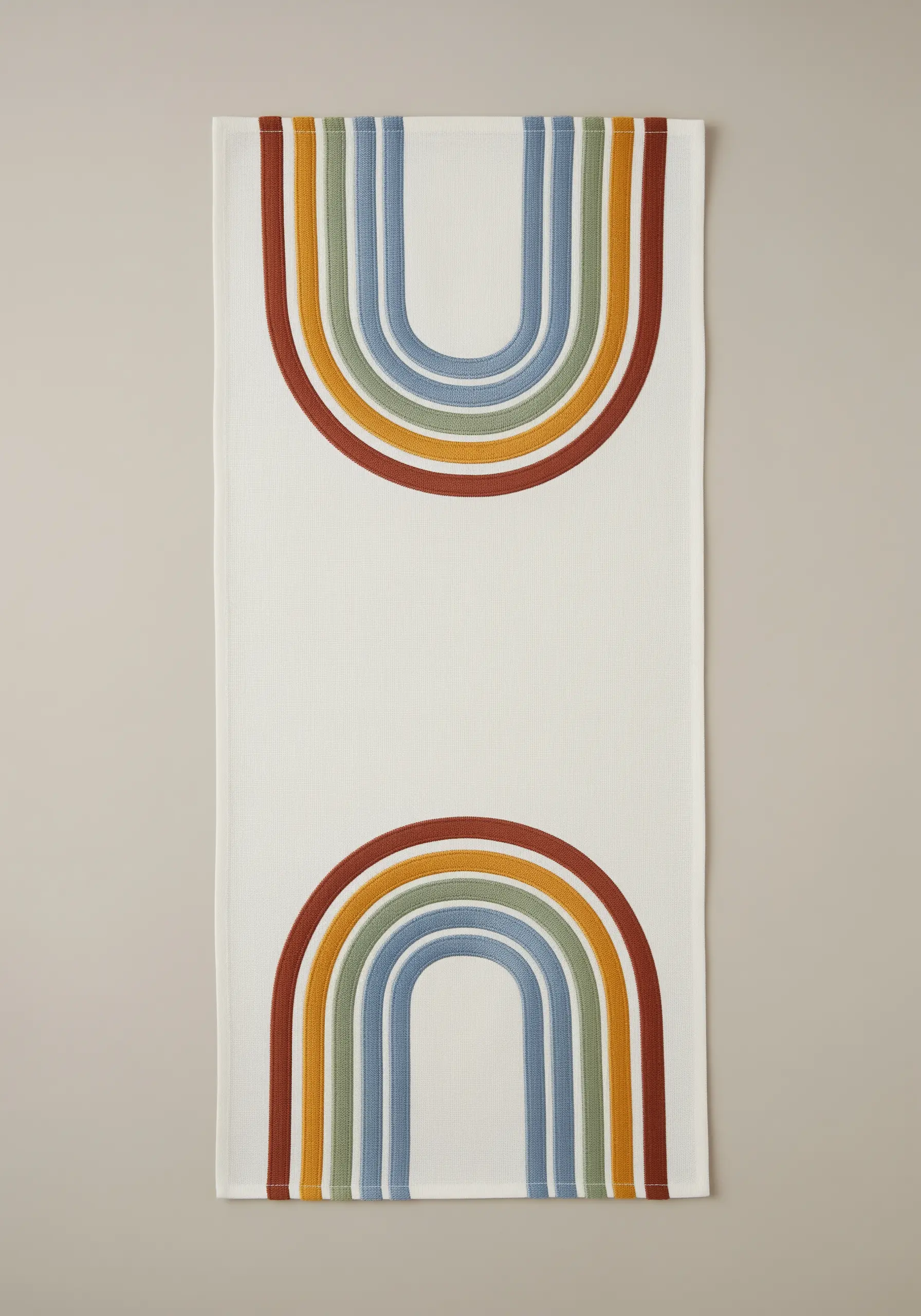 Minimalist rainbow arches in earthy tones of red, green, and blue on a neutral runner.