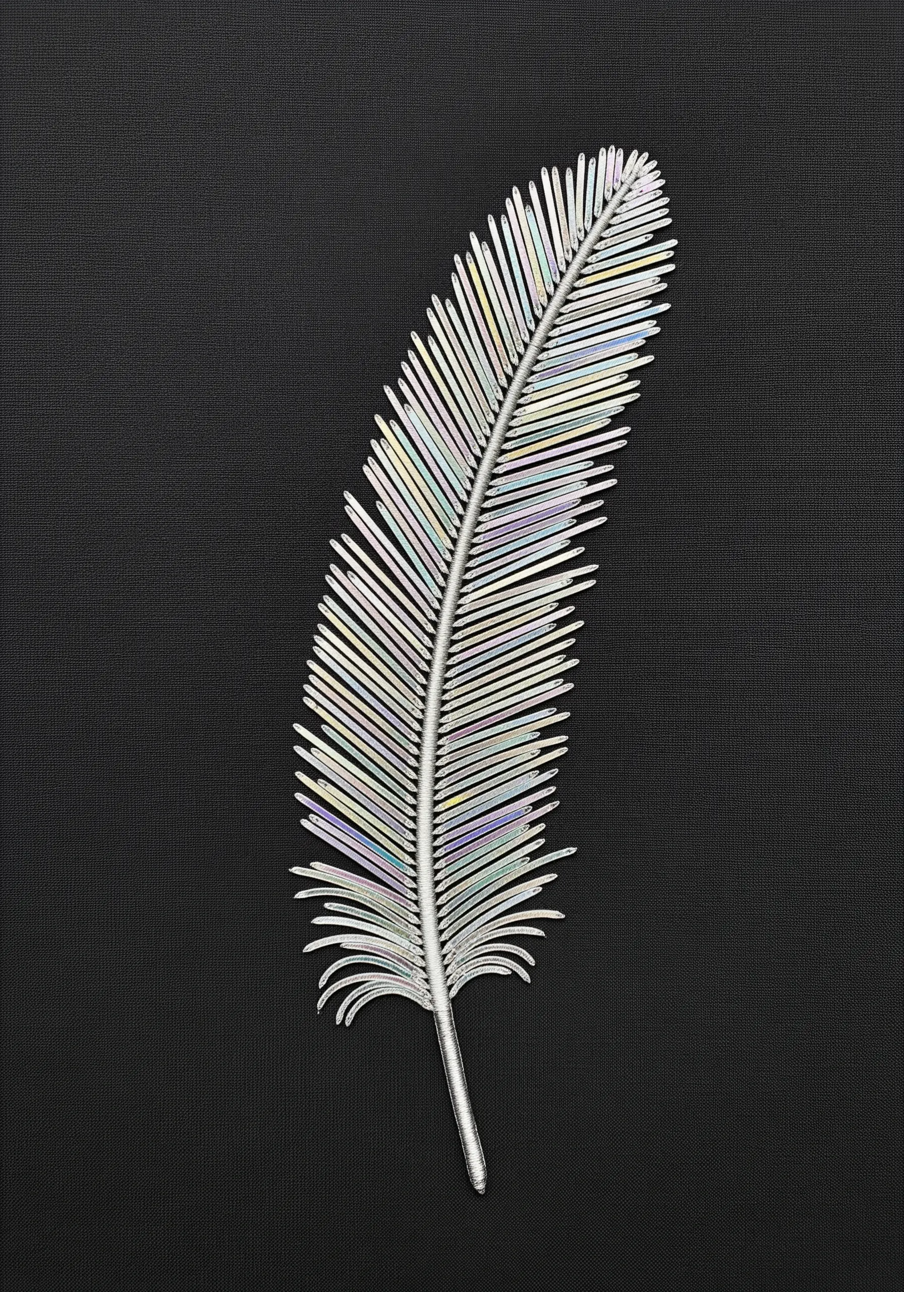 A feather constructed from thin, iridescent plastic strips stitched to a central silver spine.