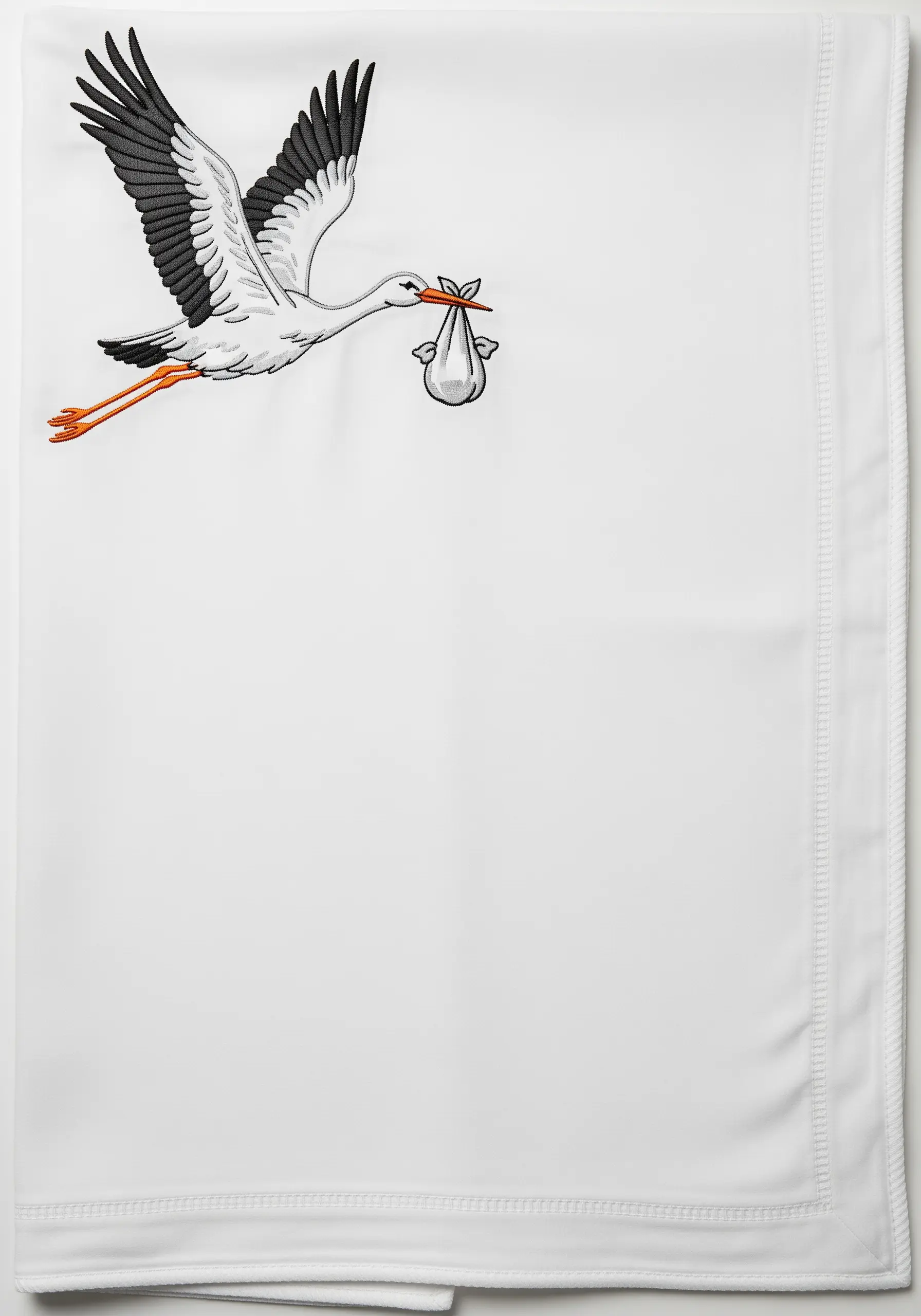A large embroidered stork carrying a baby on the corner of a white receiving blanket.