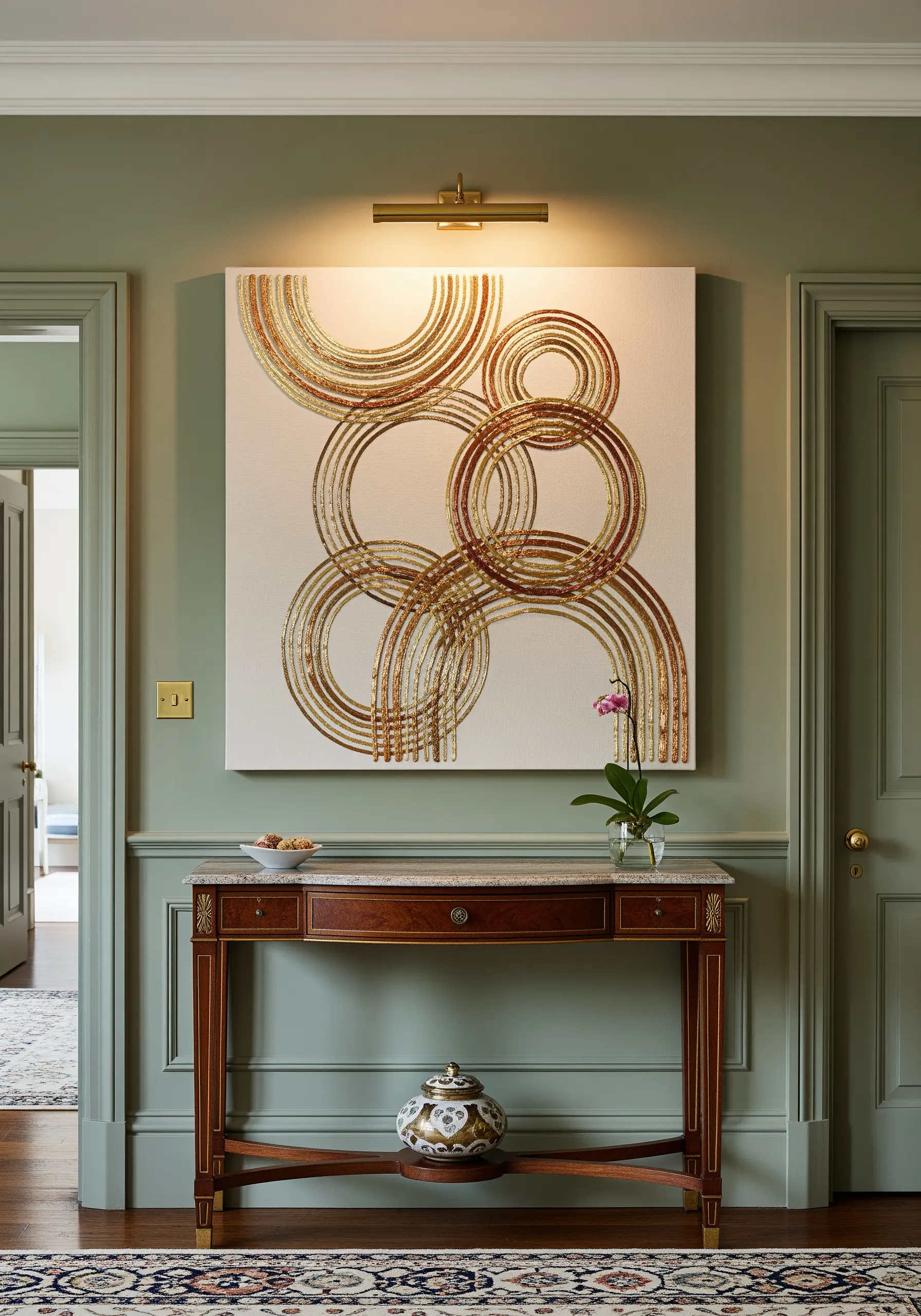 A large canvas with abstract, overlapping circles embroidered in shimmering gold and bronze metallic threads.