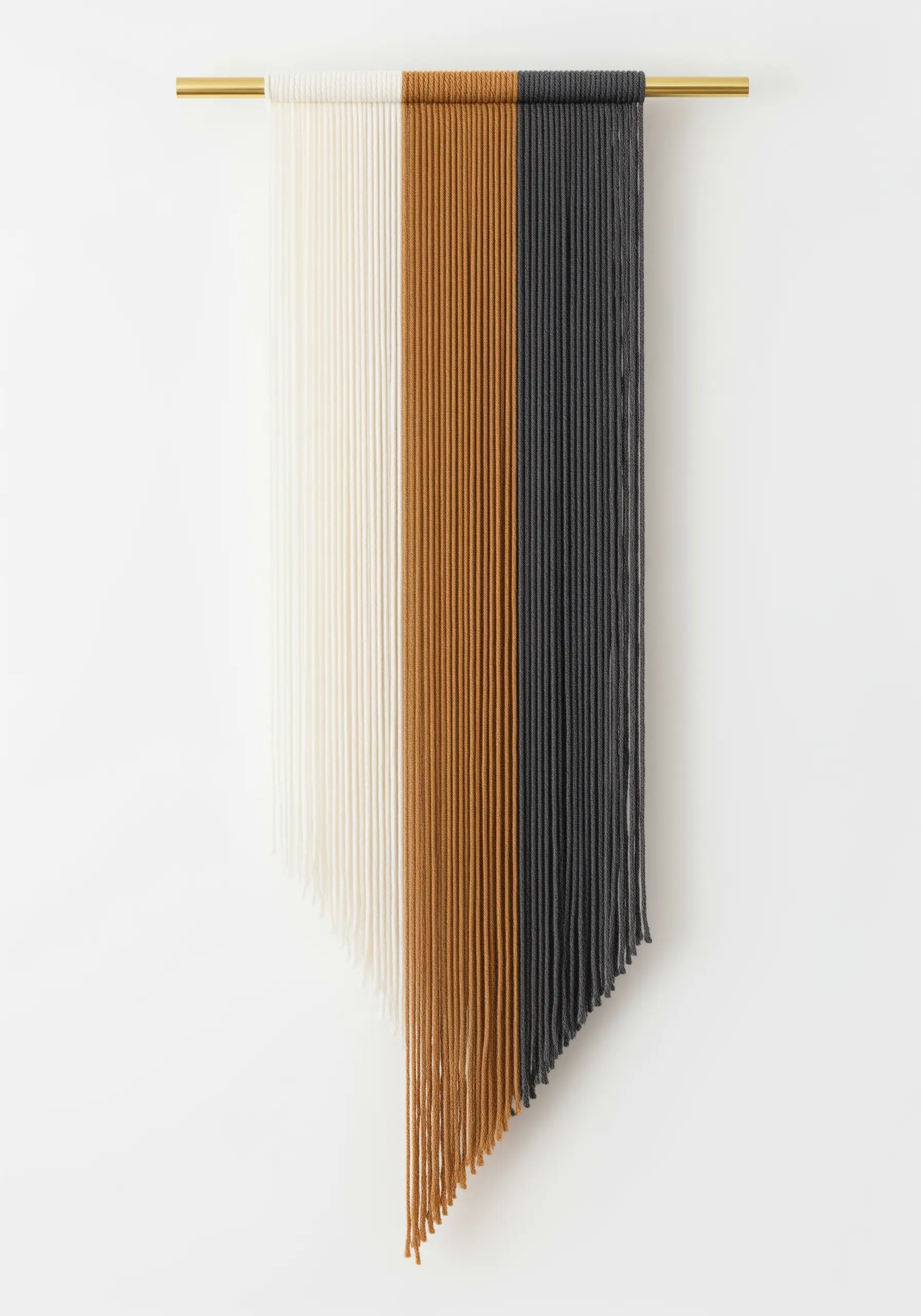 Minimalist yarn wall hanging with three vertical blocks of cream, ochre, and charcoal gray yarn.
