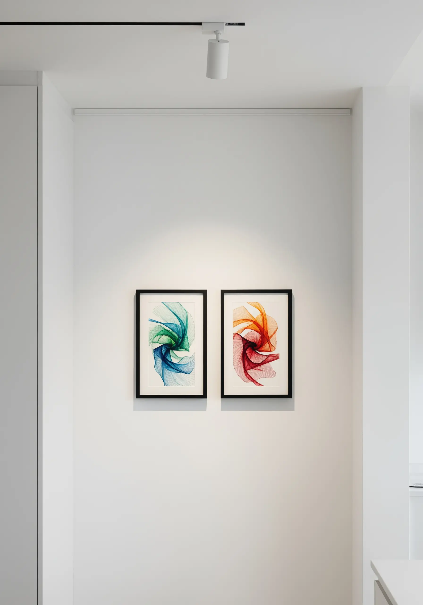 Two framed pieces of abstract thread art with swirling blue-green and red-orange lines.