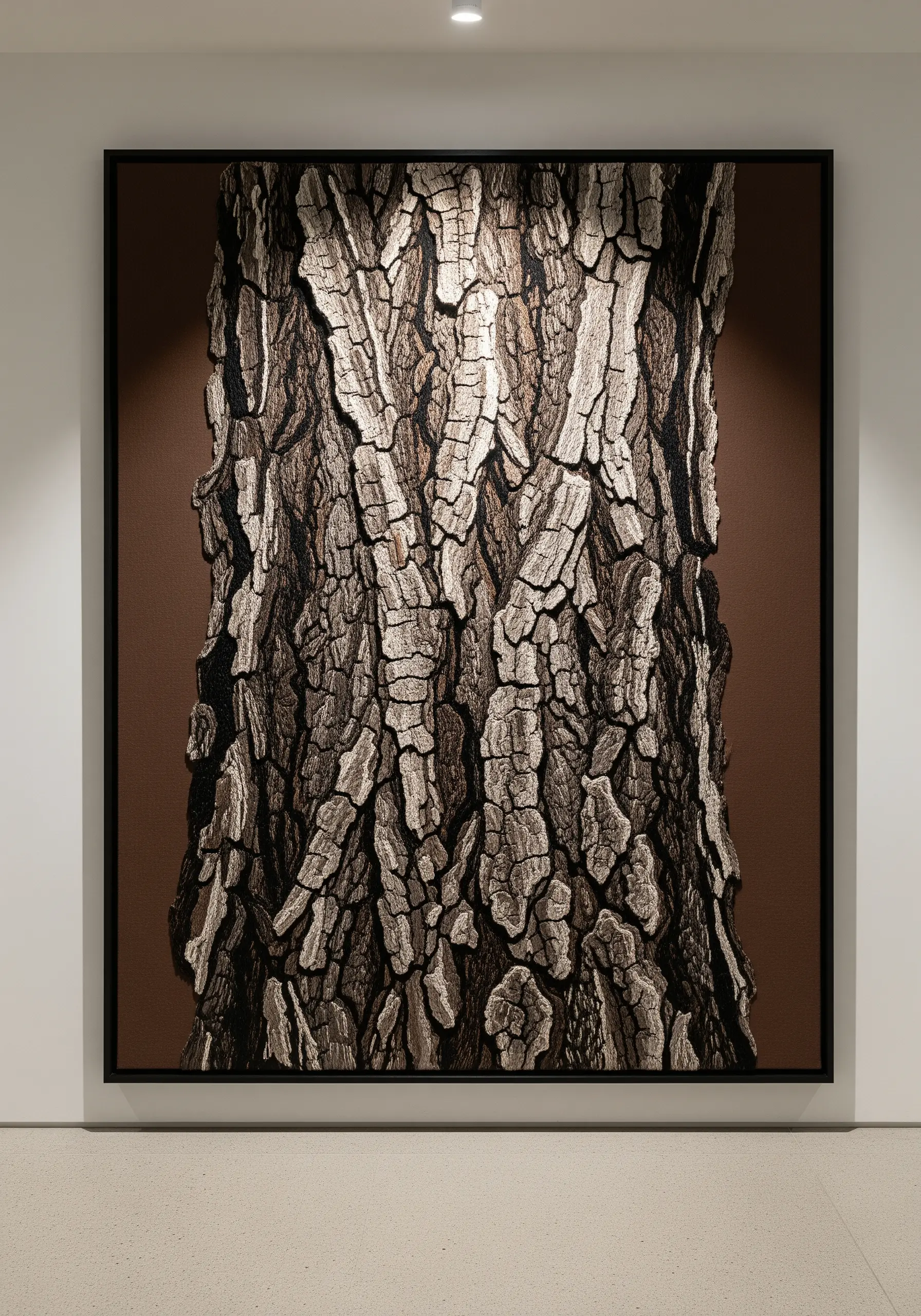 A highly detailed, framed embroidery piece that realistically captures the texture of tree bark.