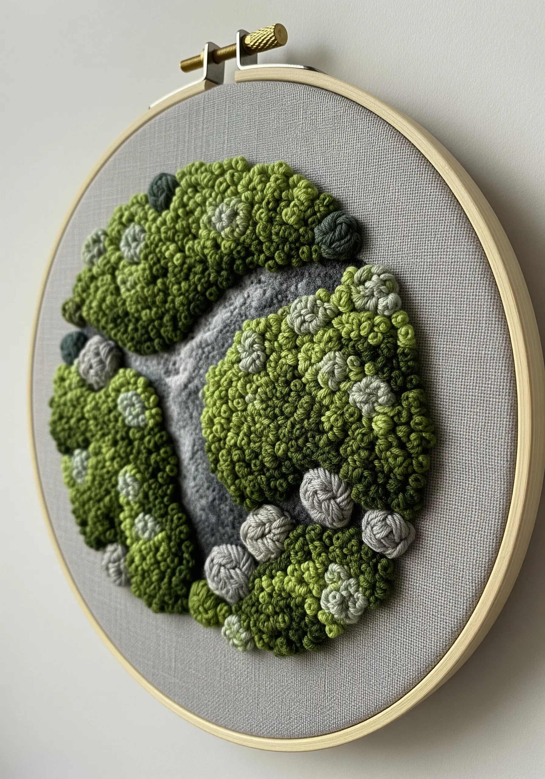 A three-dimensional mossy landscape created entirely with dense clusters of French knots.