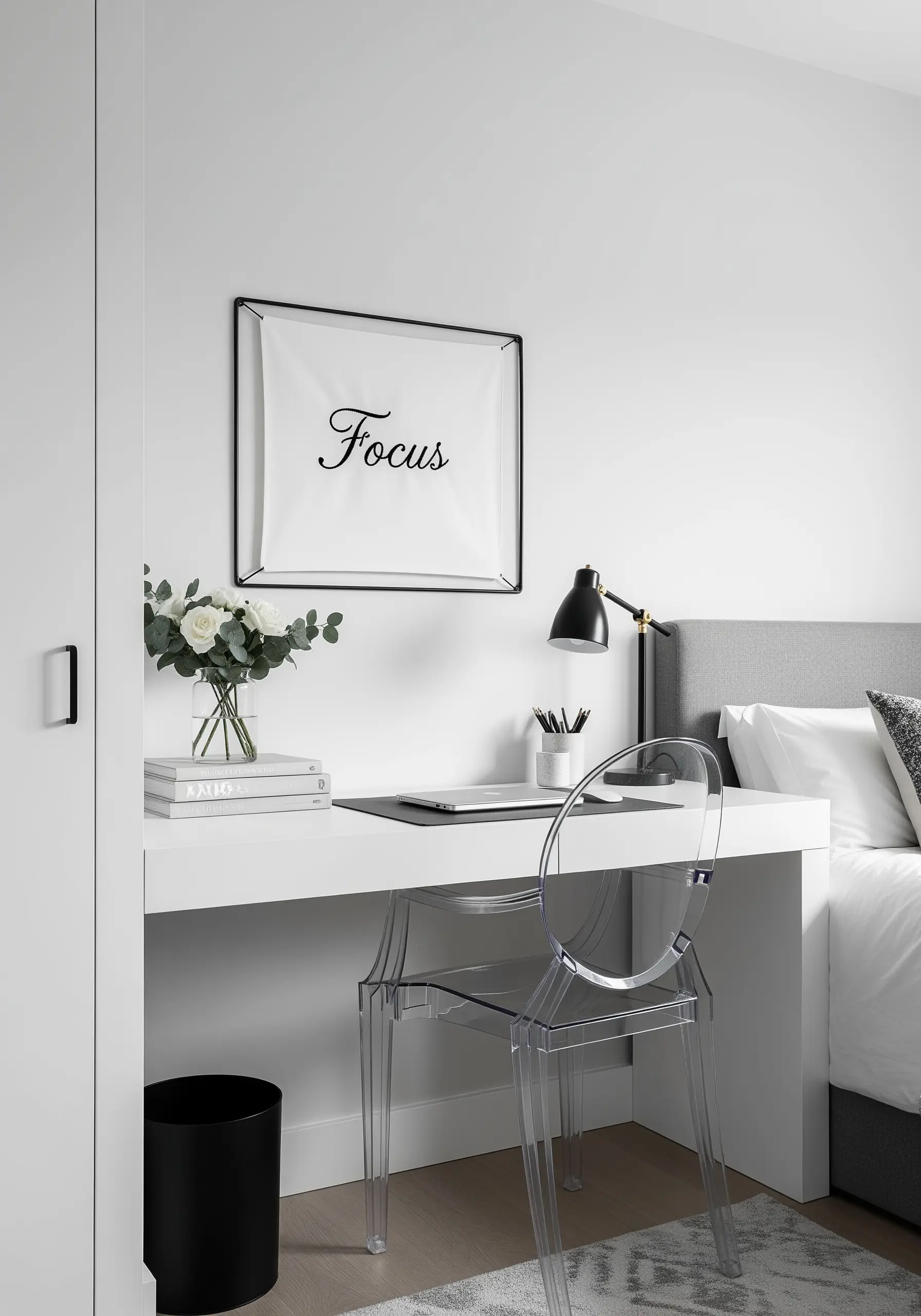 The word 'Focus' embroidered in black script on a white fabric banner with a black frame.