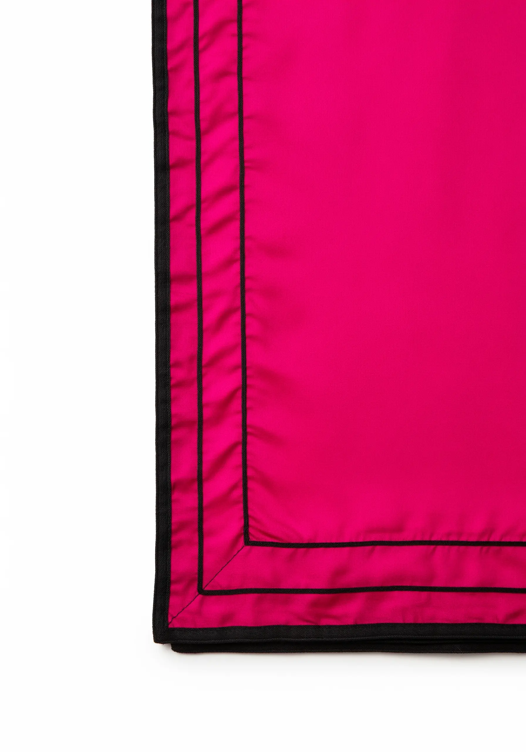 A thin black piped border framing a bright fuchsia fabric.