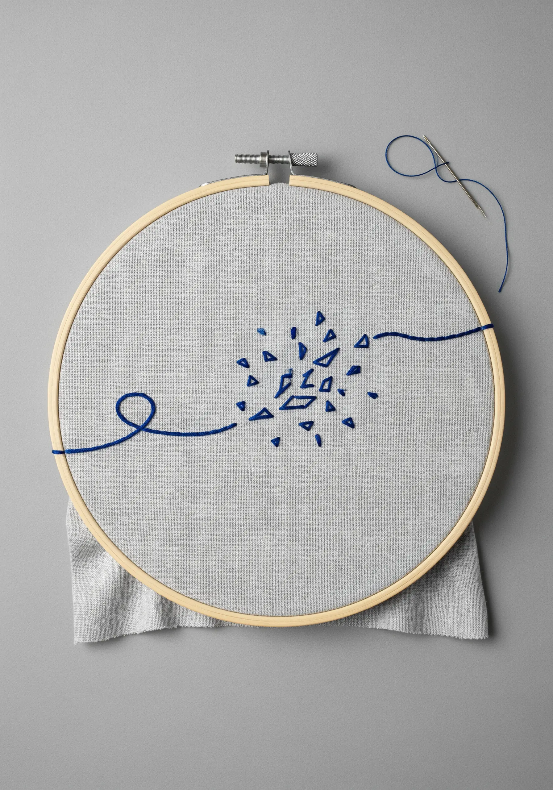 A single blue thread forms a line that breaks into tiny geometric shapes then reforms.