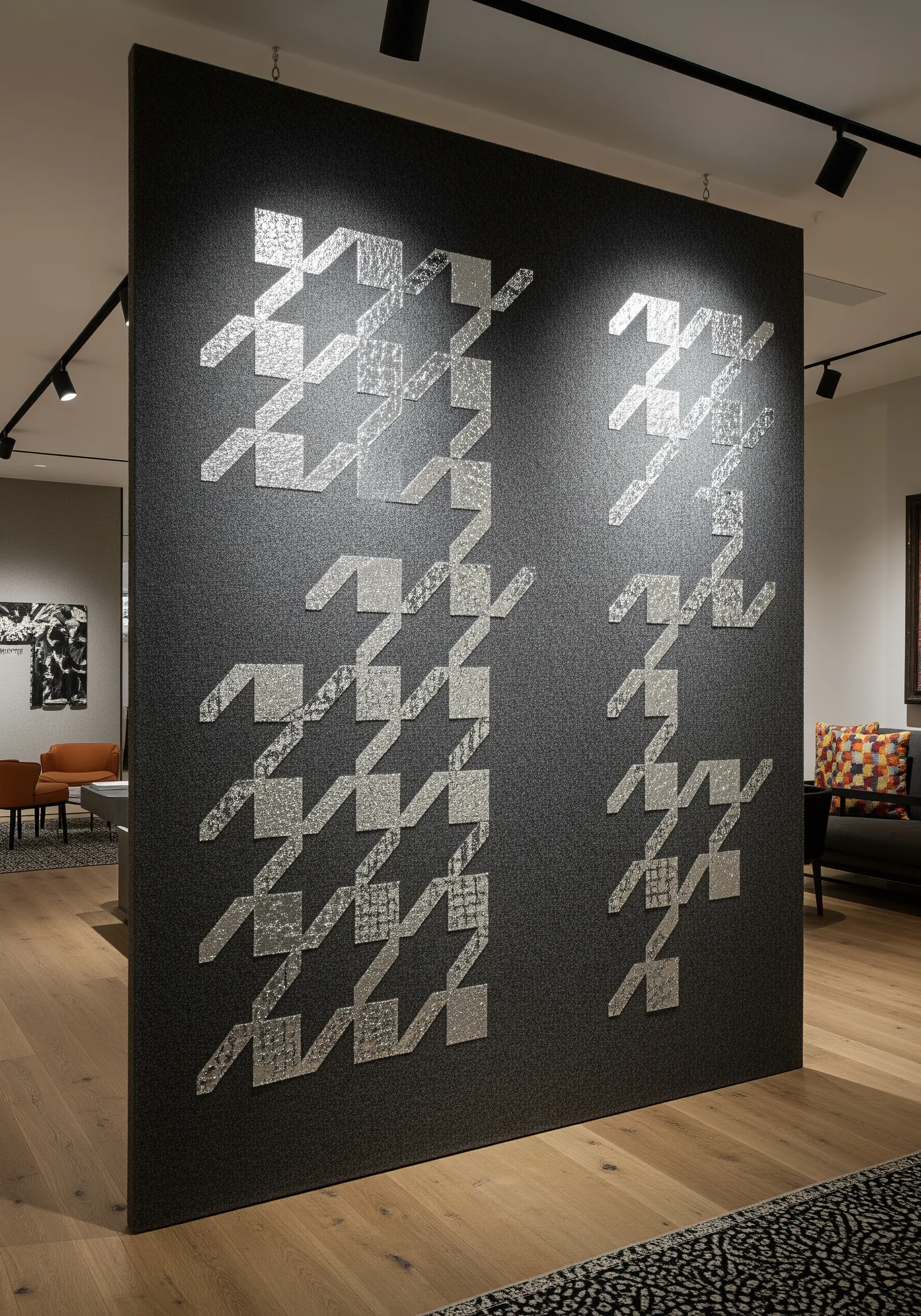 A large wall divider with an abstracted houndstooth pattern made from reflective silver material.