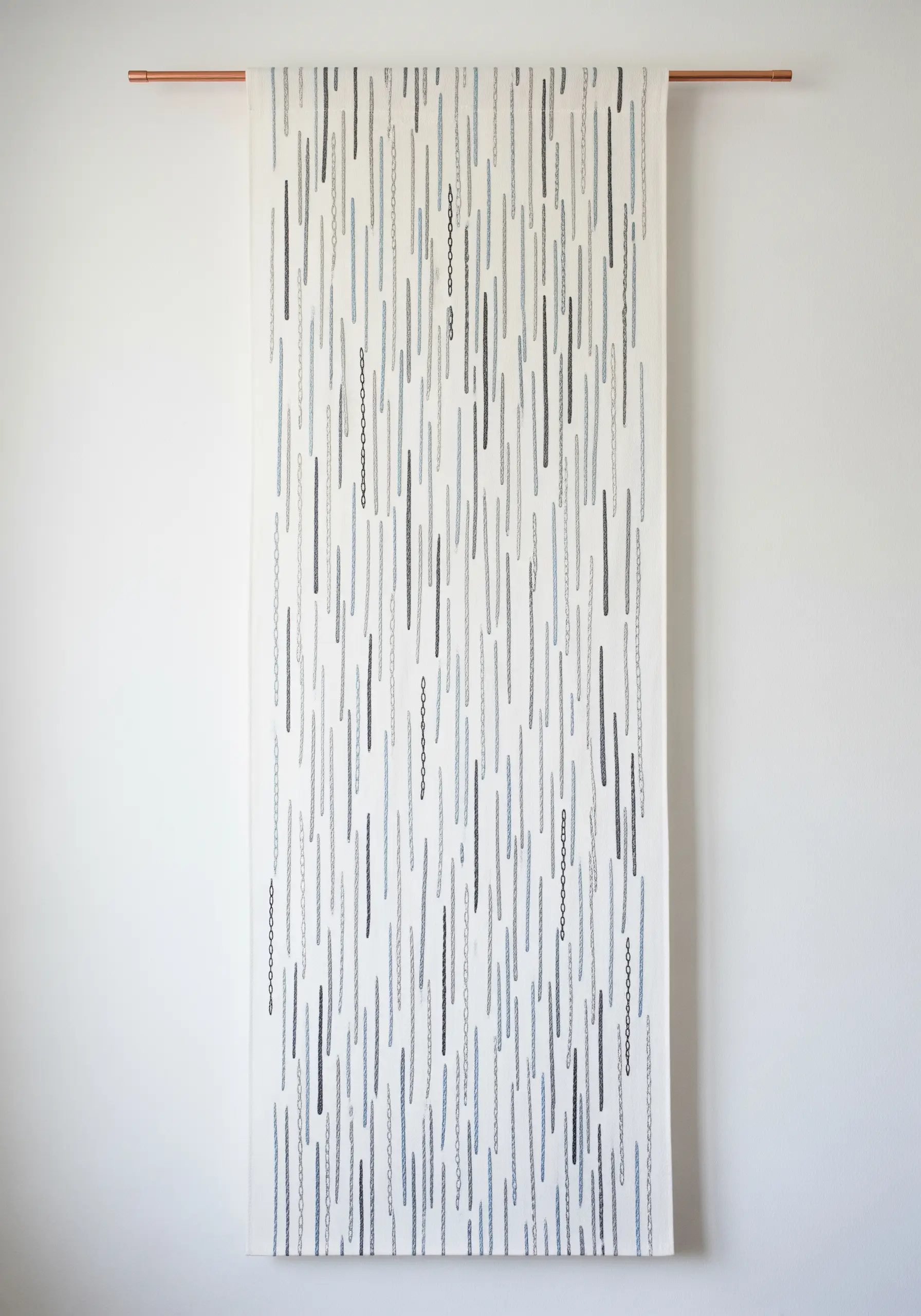 Wall hanging with an abstract pattern of vertical lines in blue and gray tones.
