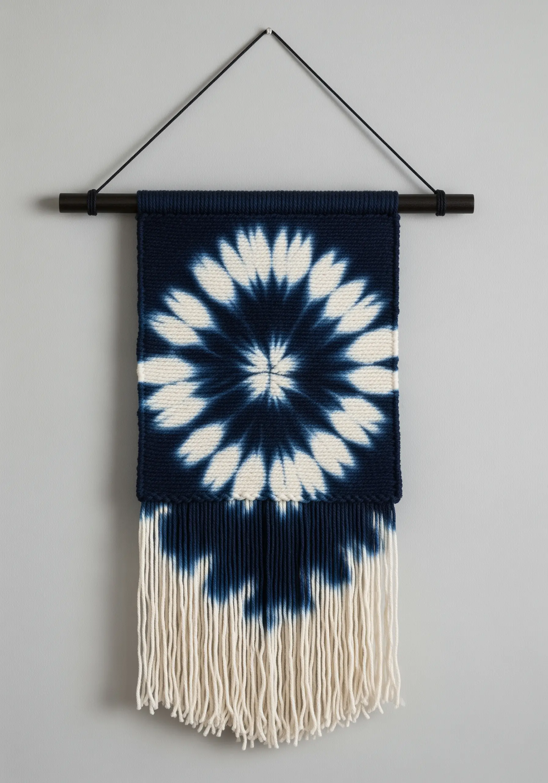A small woven wall hanging with a Japanese Shibori-style indigo tie-dye pattern.