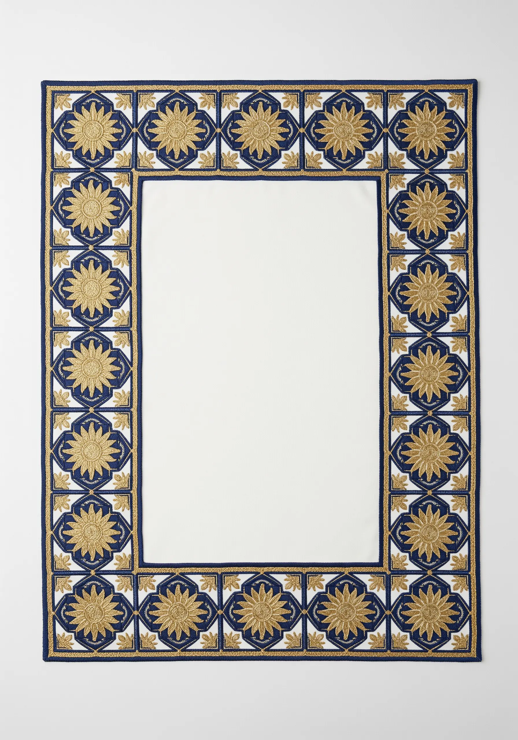An ornate placemat border with gold suns inside deep blue embroidered tiles.