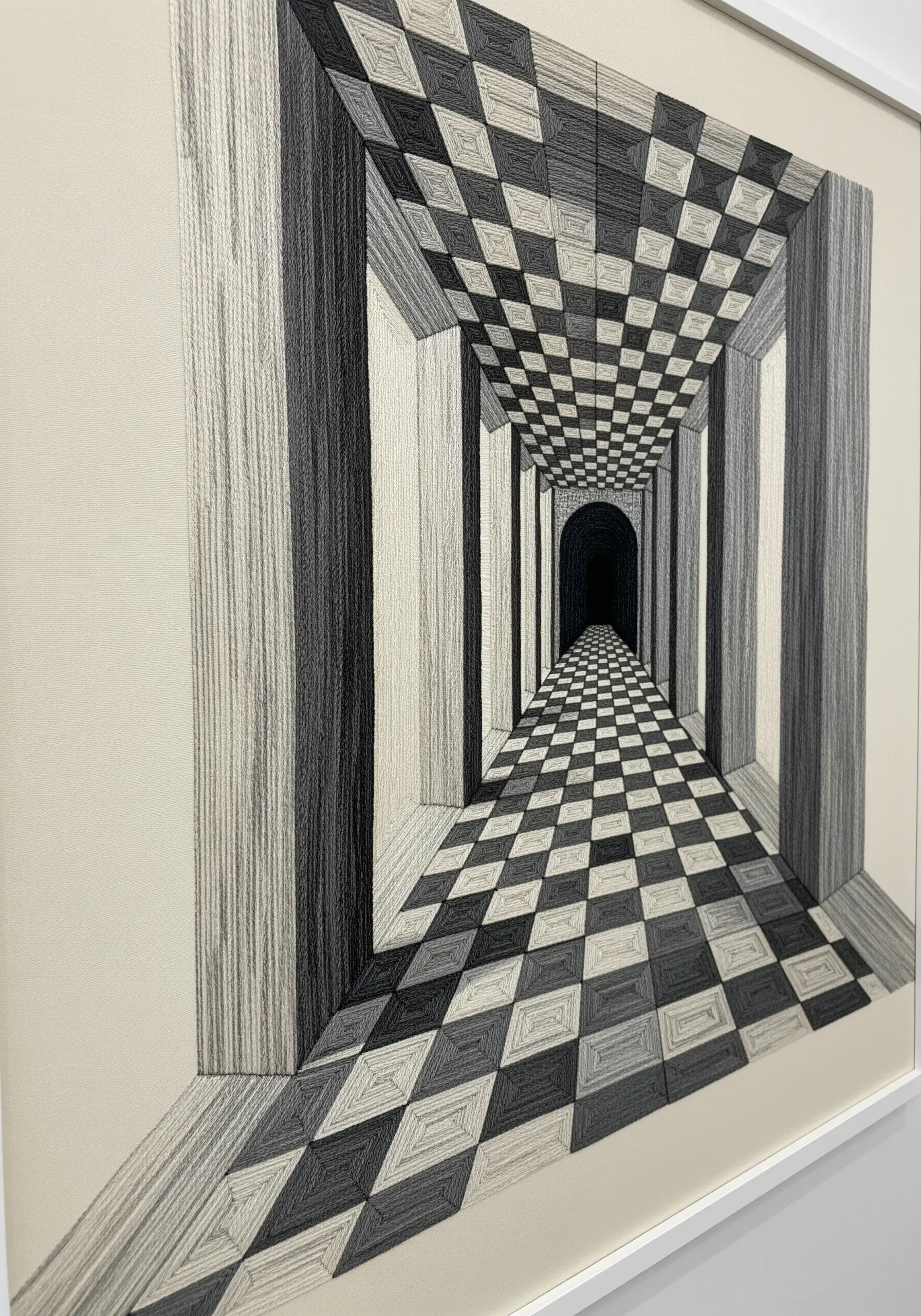 Thread painting of a long, checkered hallway creating an illusion of deep perspective.