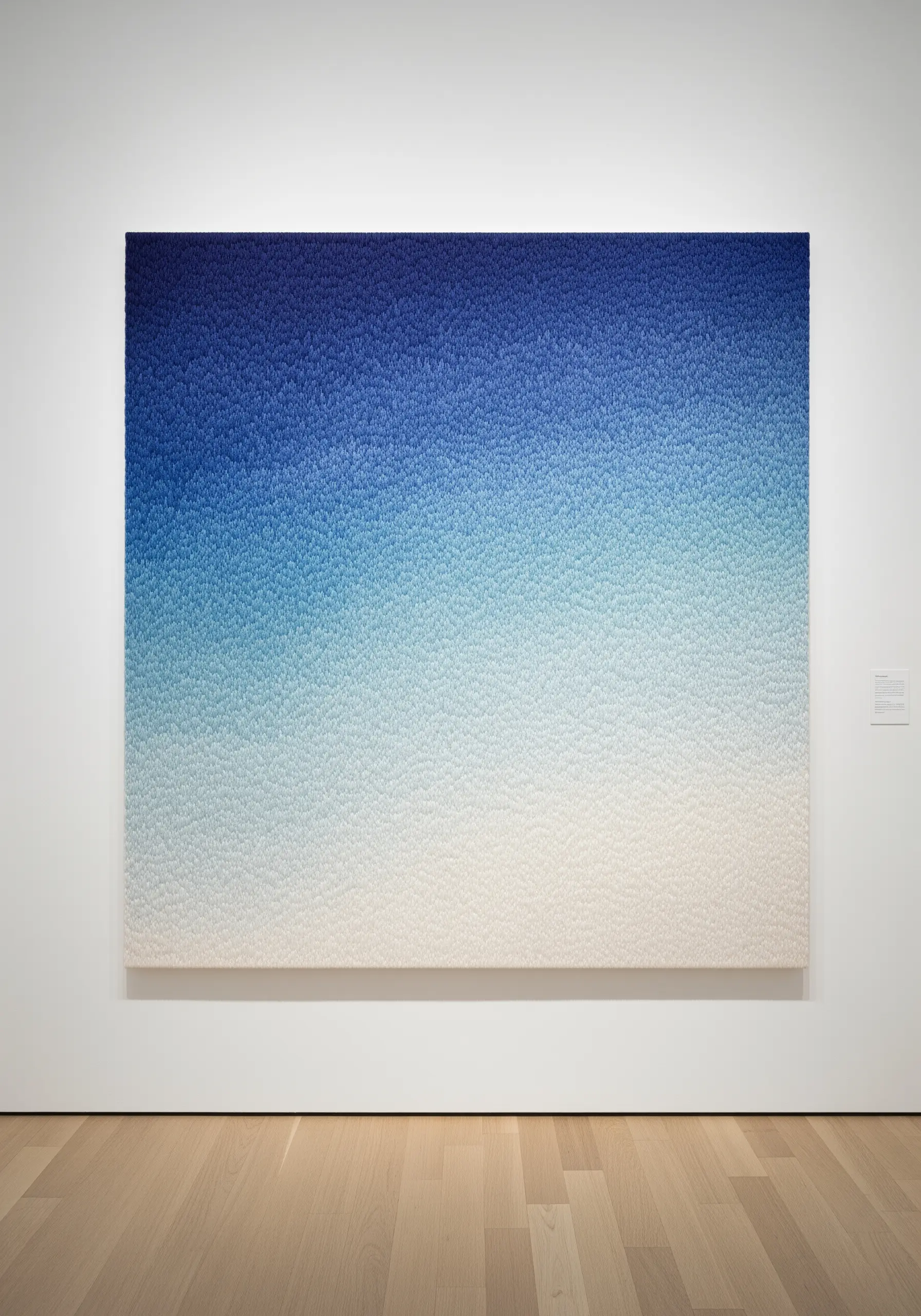 Blue to white gradient embroidery using varying stitch density